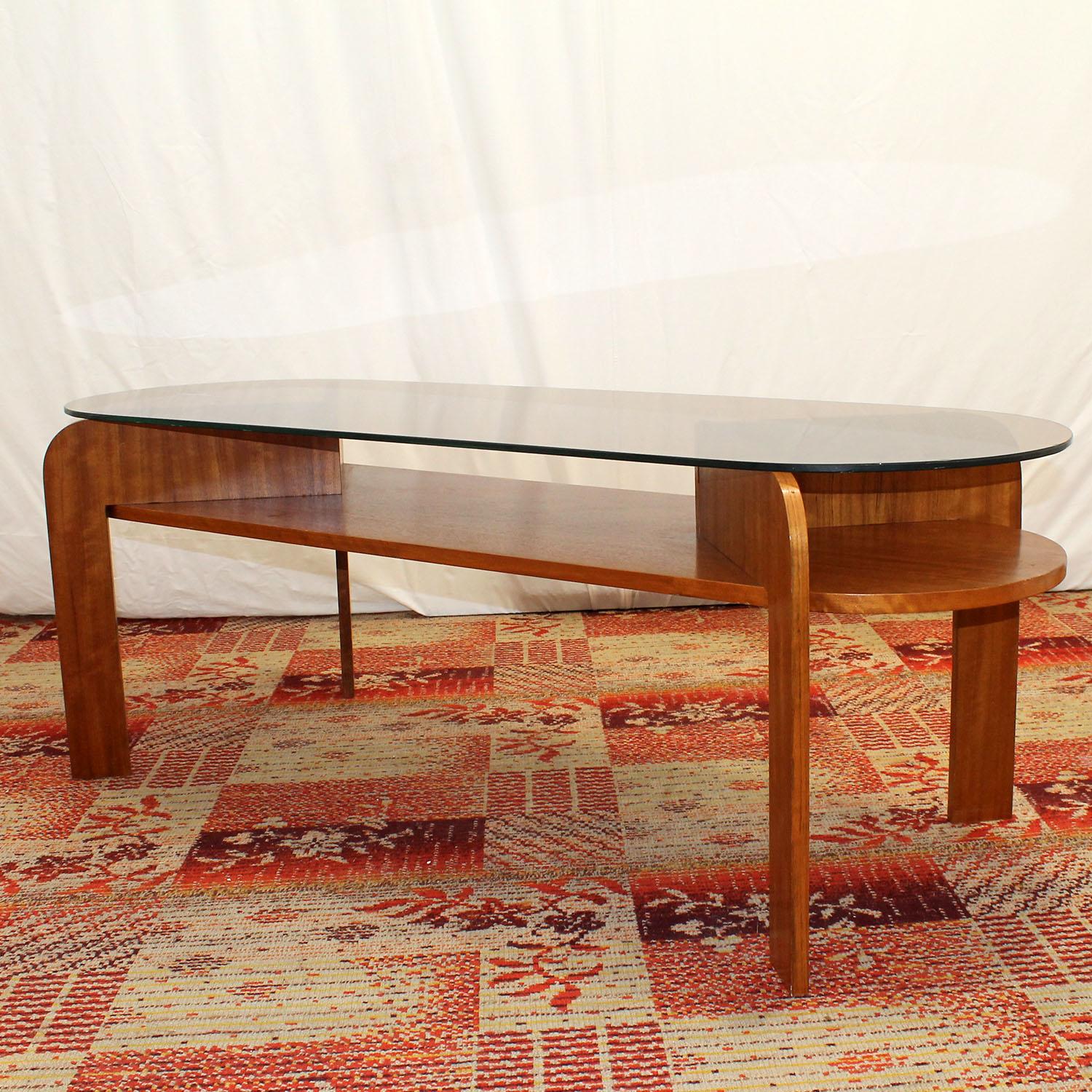 This coffee table was made in the former Czechoslovakia in the 1980’s. It´s made of mahogany wood and glass. The glass plate is removable.
The table is in very good Vintage condition.

Measures: Height 53 cm

Length 145 cm

Width 50 cm.
