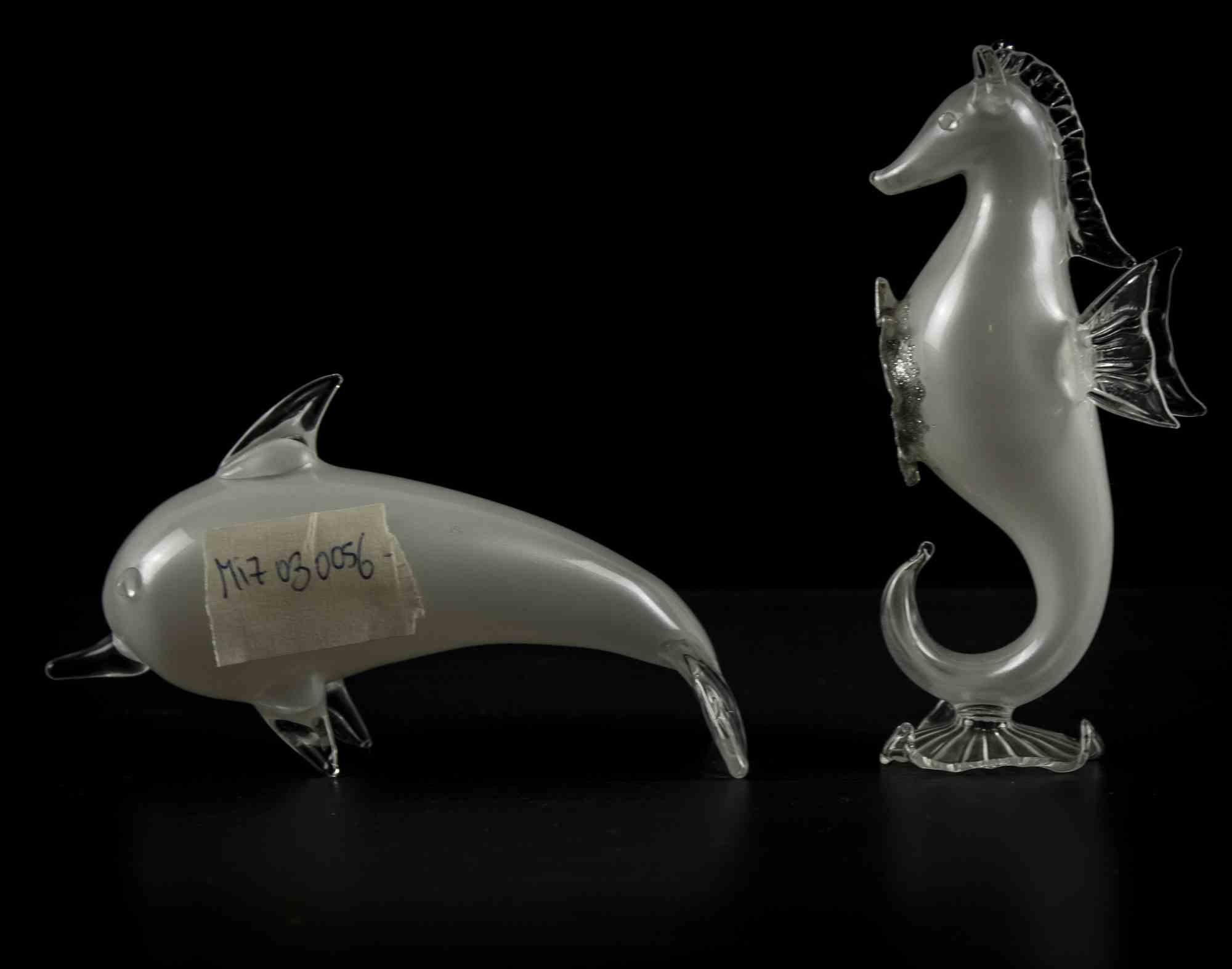 Dolphin and seahorse is a original decorative object realized in the half of 20th century.

Made in Italy. 

Original art glass with silver glitter.

The set includes a dolphin and a seahorse realized with the same material. 

Different