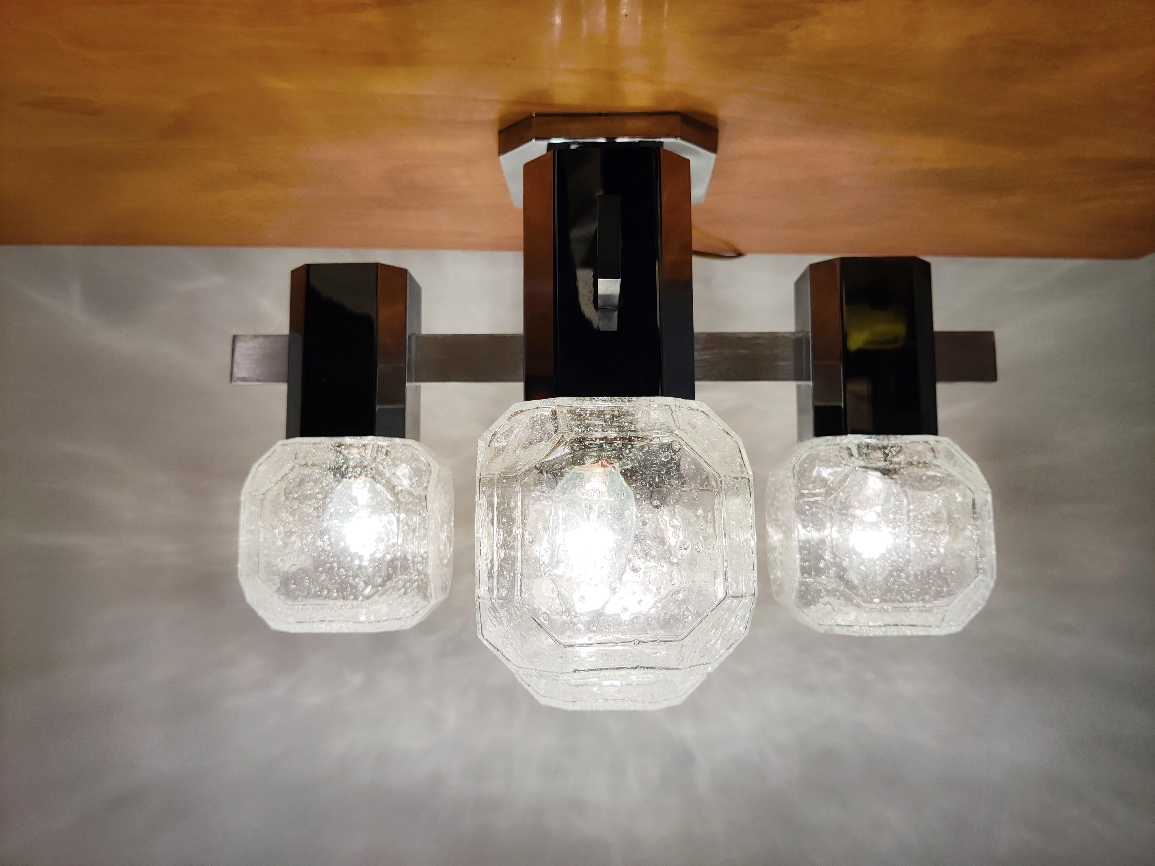 Midcentury chrome and cubic glass flushmount chandelier by Cosack Leuchten.

These lamps can also be used as table or wall lamp.

Beautiful glasses which emit a lovely light.

Good condition,

1970s, Germany

Tested and ready to use with regular E14