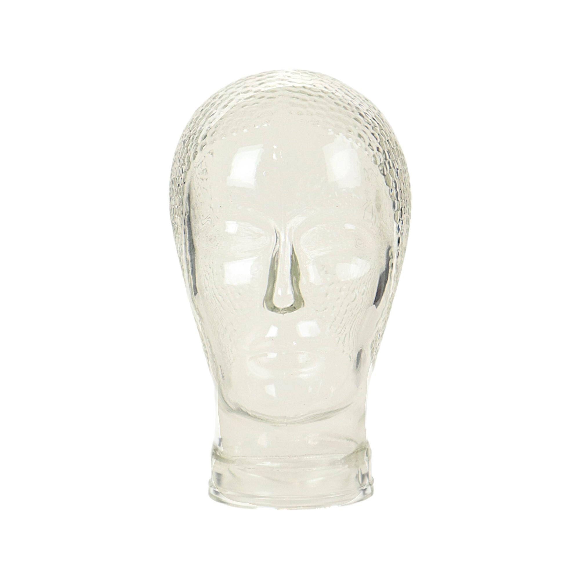 Cool vintage display, mannequin head, transparent pressed glass with anti-slip studs on the skull, 60s-70s.

Nice vintage object to use for example for headphones, hat or wig, but also beautiful as decoration in the living room or hobby room.

In