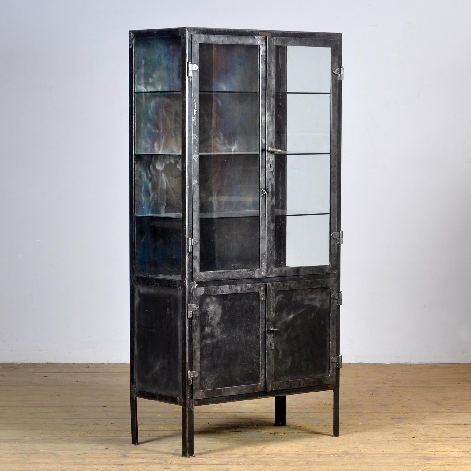 vintage metal cabinet with glass doors