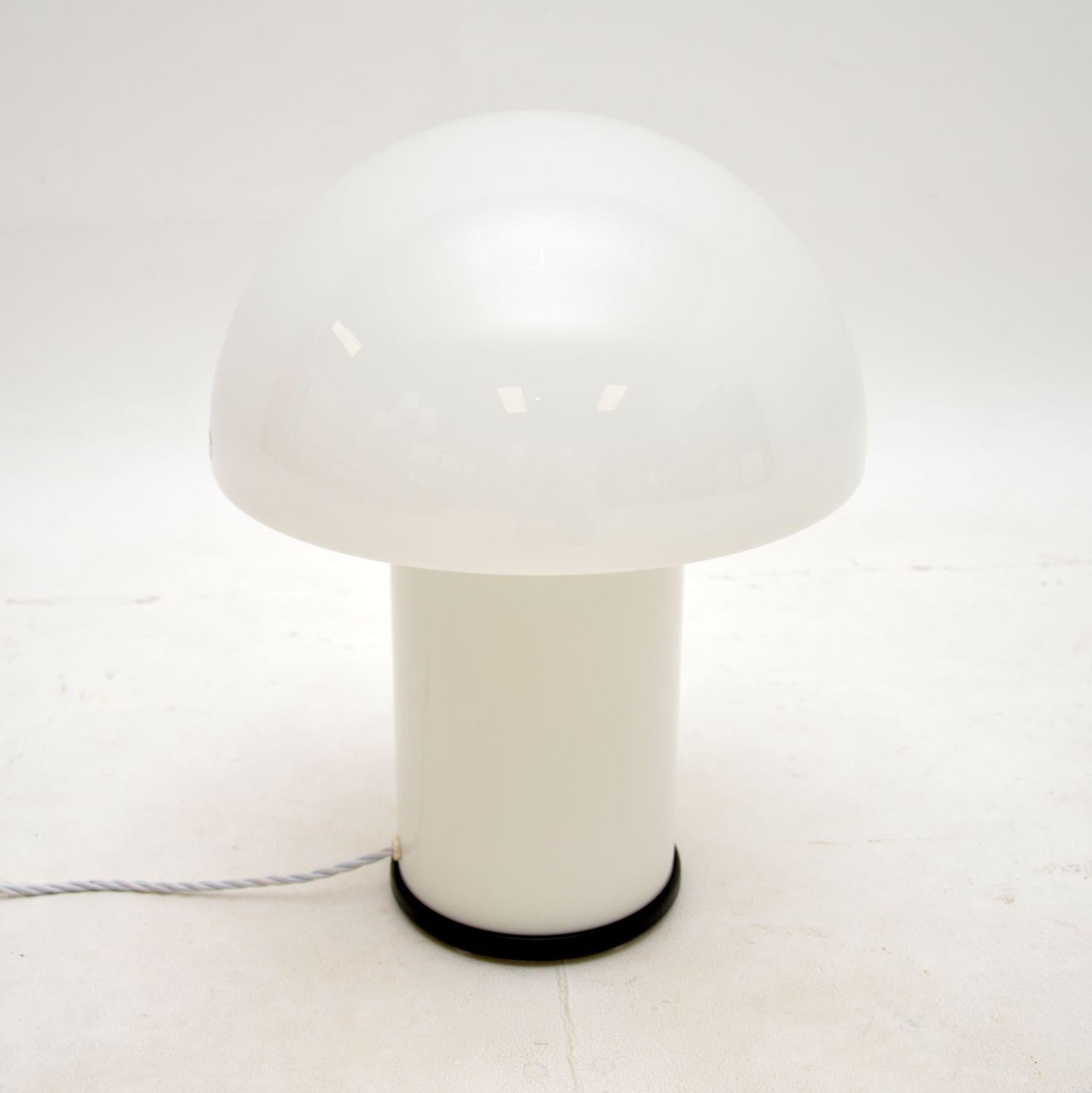 A stylish and very well made vintage glass mushroom lamp by Peil and Putzler. This is hand blown Italian Murano glass, imported to Germany and made by Peil and Putzler in the 1970’s.

The quality is outstanding, this is an impressive and useful