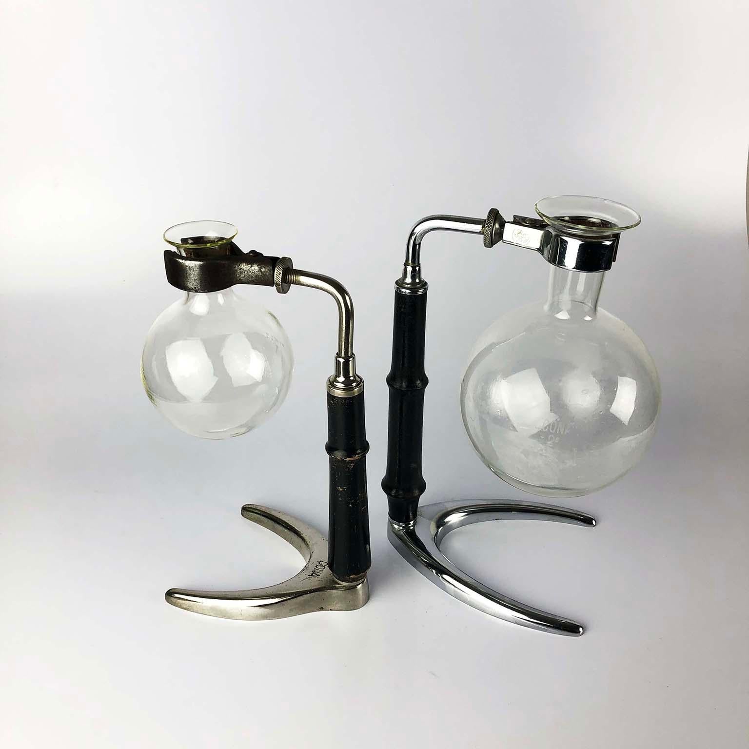 Pair of rare vintage glass science lab stands with amazing design and original glass, circa 1950.

Each lab stand has a steel and chrome base, wood and shaft and the glassware beakers shown are included.

They make fantastic industrial