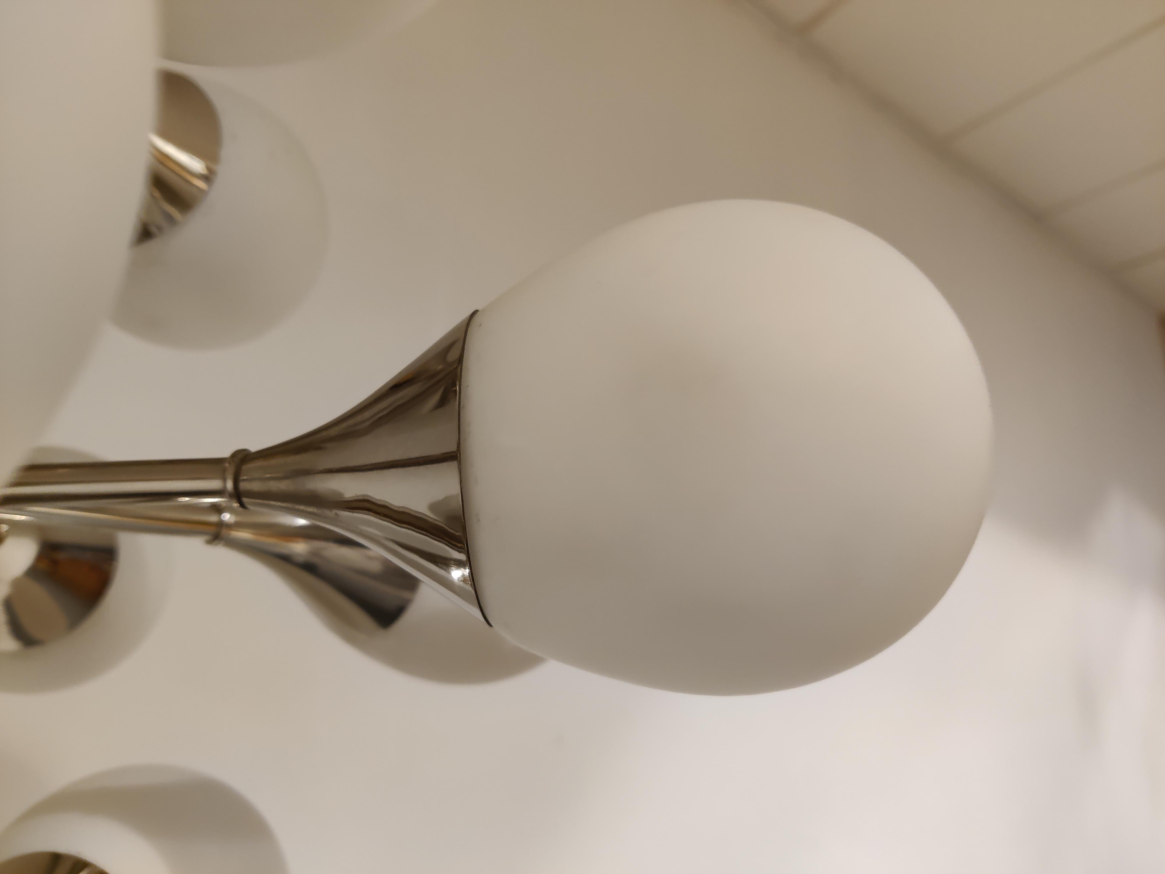 Mid-century chrome and opaline glass sputnik chandelier by Kaiser Leuchten.

Lovely teardrop shaped white glass shades.

The chandelier emits a ambient diverted light.

The chandelier has 12 E14 light points.

The lamp has been