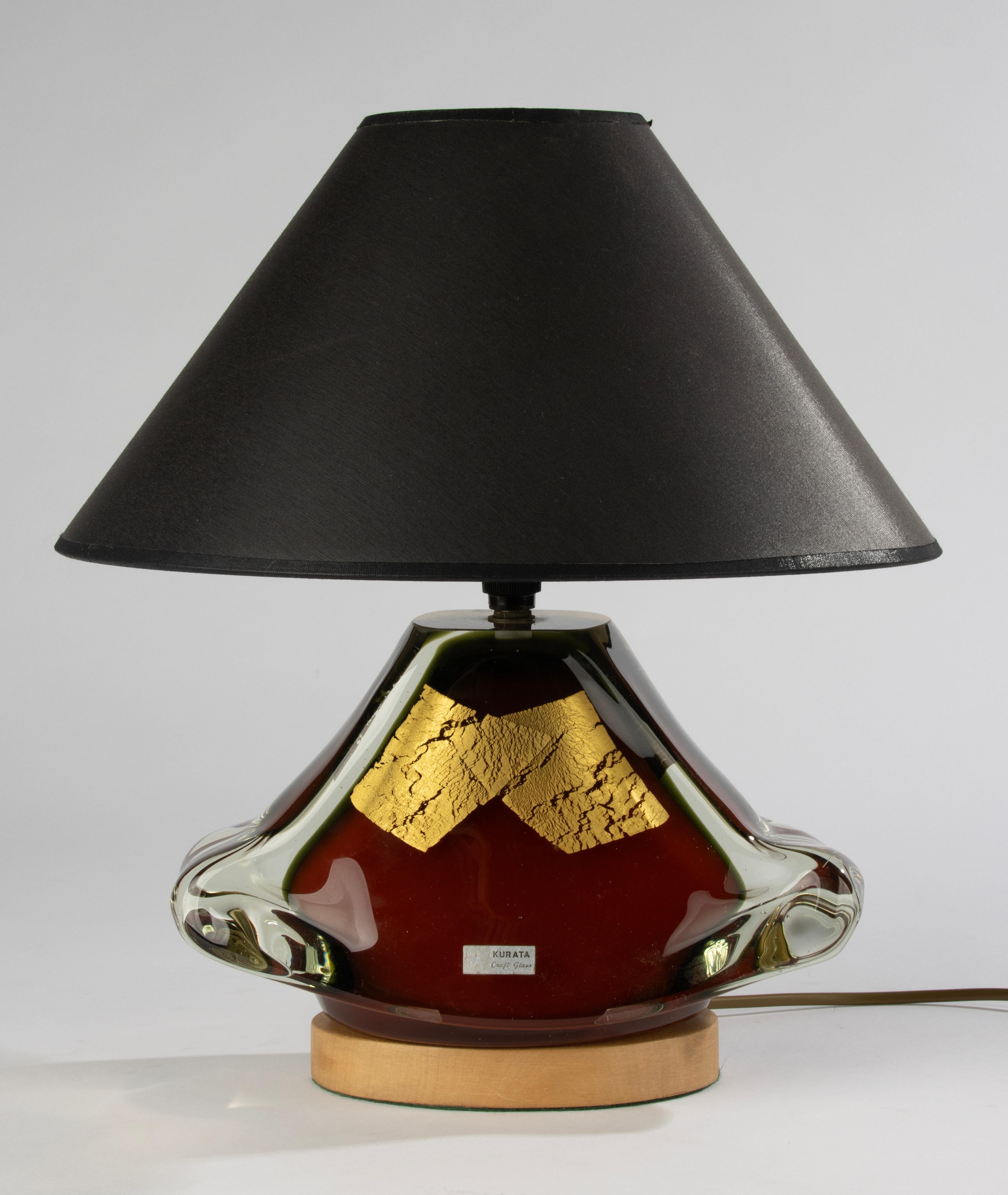 A beautiful vintage art glass lamp, made by the Japanese brand Kurata Craft Glass. 
The glass is multi layered, with a deep red colour and gold decoration inclusions. 
Very nicely shaped. 
Electricity suitable for all continents. 
Sold without