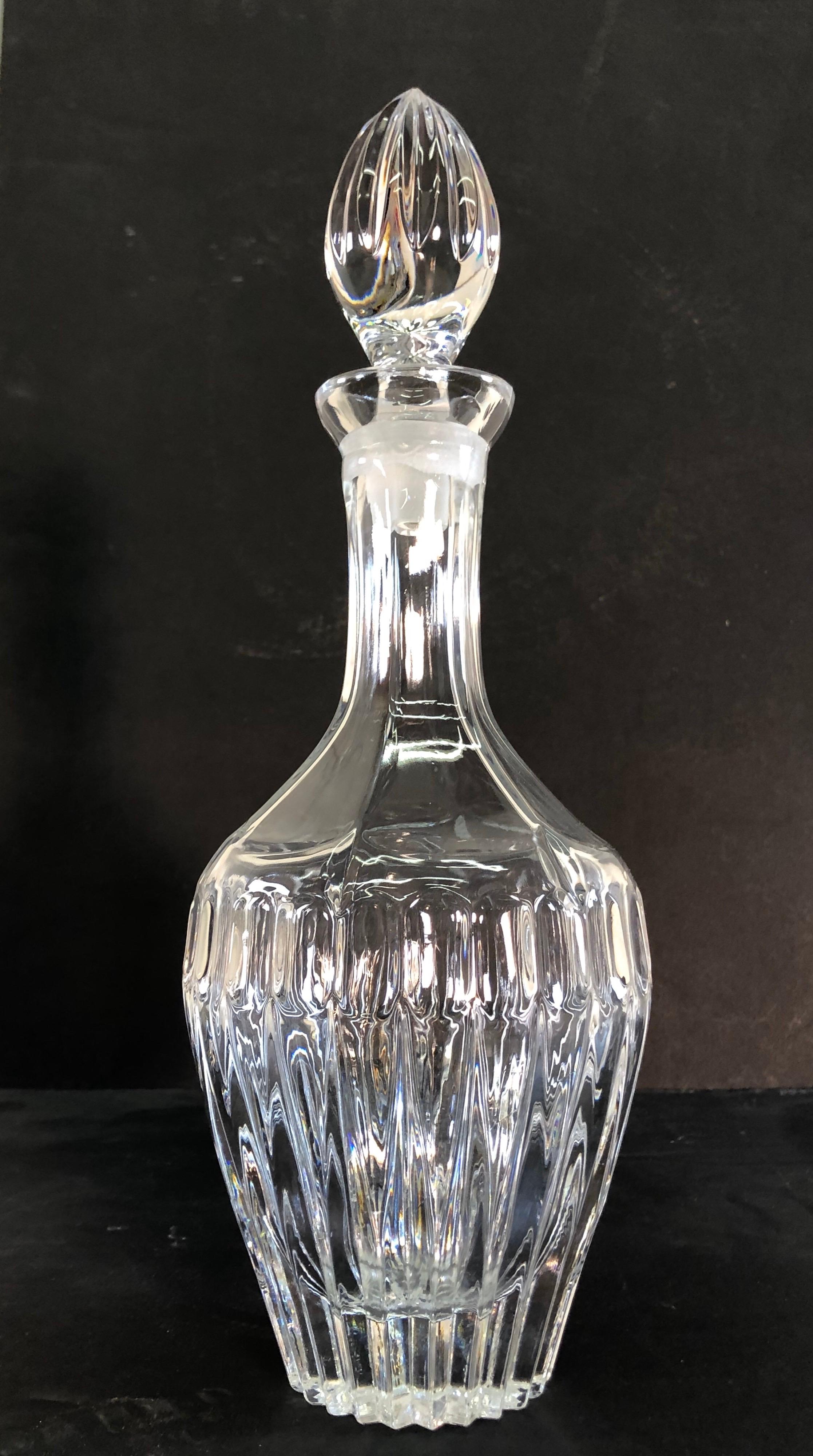 Vintage 1970s tall glass decanter with the stopper in a heavy glass design. No marks. Excellent condition.