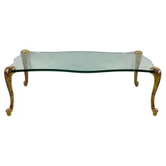 Table basse vintage avec plateau en verre et pieds dorés - p.e. Style Guérin