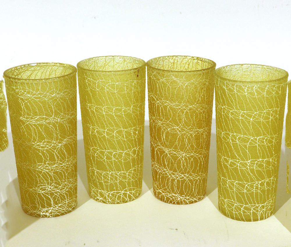 Pretty & Functional!

Vintage glass tumblers, spaghetti string pattern,
Color craft, Indianapolis, In., set of eight.

The set of Color Craft lemon-yellow tumblers are known as “Shat-R-Pruf glasses. They are crystal clear glass inside and