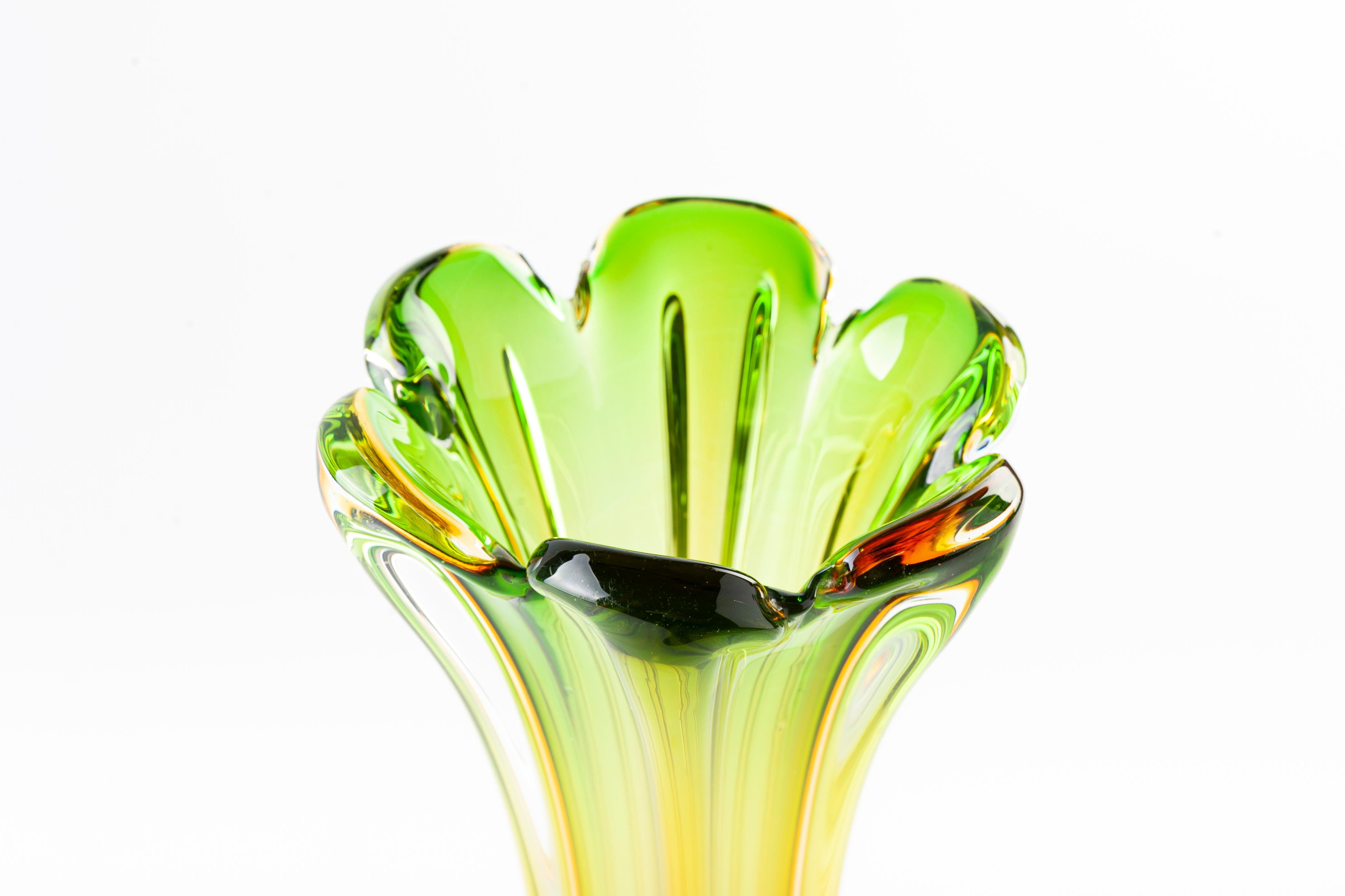 This vintage glass vase with the color of green, yellow and orange faded away, realized in Northern Europe during the 1970s.

Excellent condition.

This object is shipped from Italy. Under existing legislation, any object in Italy created over 70