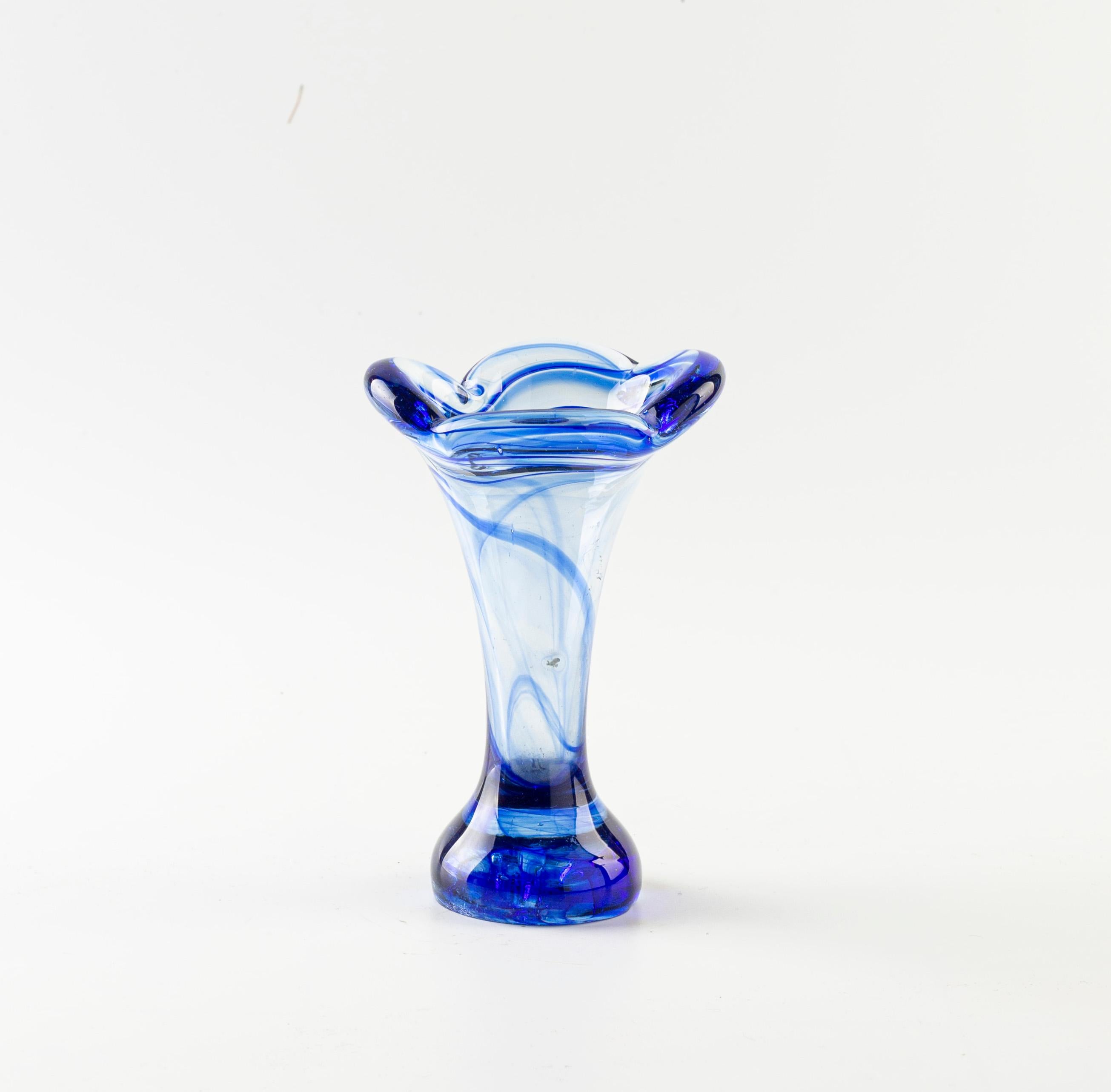 This blue vase with Daisy mouth is a beautiful vintage art glass piece of Northern European manufacture, realized during the 1980s.

In excellent conditions.

This object is shipped from Italy. Under existing legislation, any object in Italy created