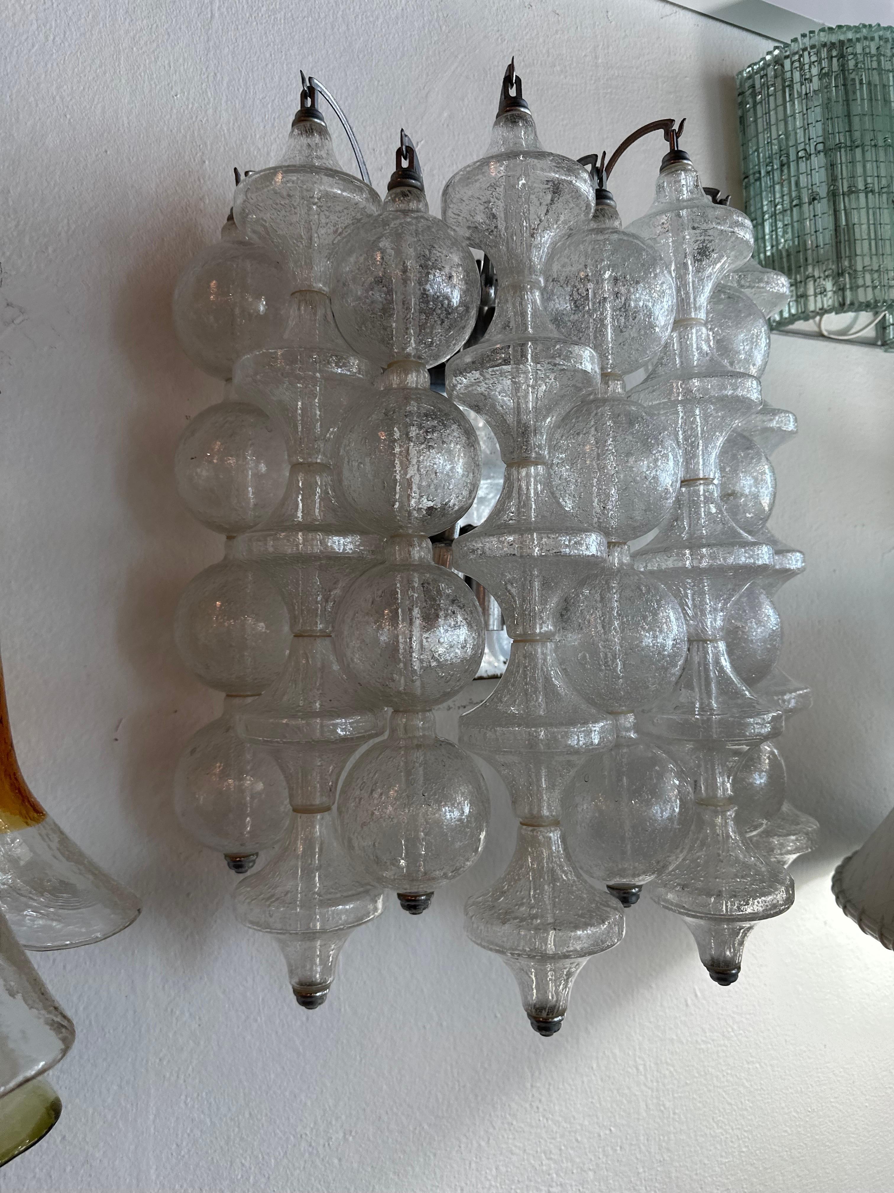 Beautiful vintage wall light sconce by J. T. Kalmar Tulipan, This has 9 rows of bells and bubbles. Holds 8 light bulbs. No chips or breaks to glass pieces. Patina to fixture. Dimensions: 19 H x 16 W x 8 D.