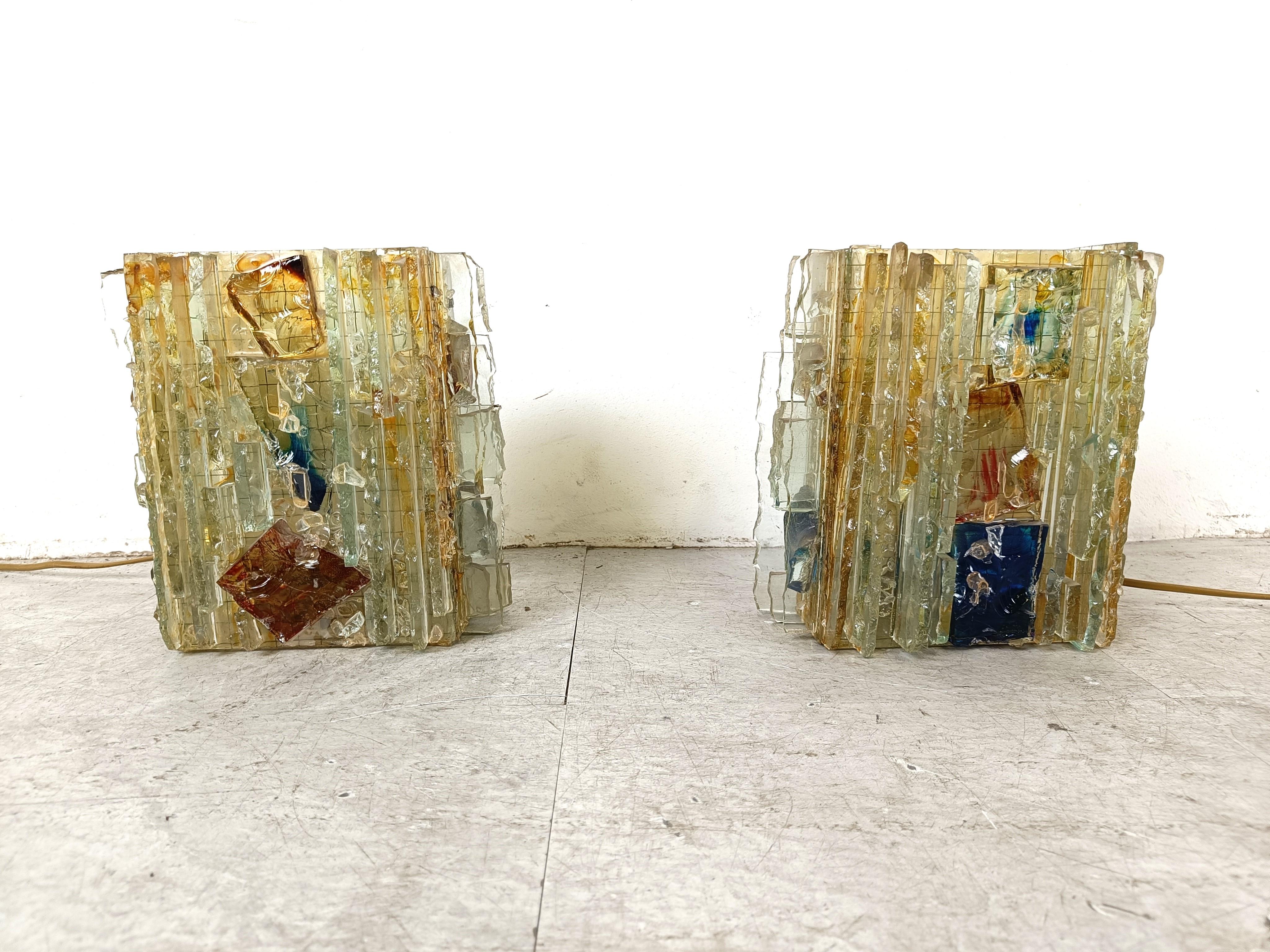 Mid century wall sconces made from glass by Willen van Oyen Sr. for Raak Amsterdam.

These stunning hand made brutalist wall lights emit a beautiful light.

This model is named 'Chartres' as these lamps were inspired by the stained glass windows of