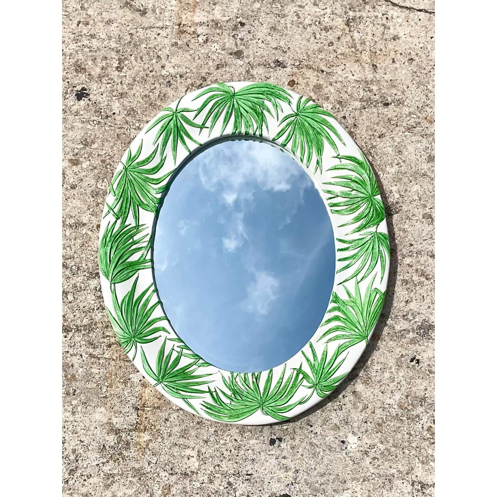 Fantastic vintage glazed ceramic mirror. Fabulous palm frond design. Acquired from a Palm Beach estate.