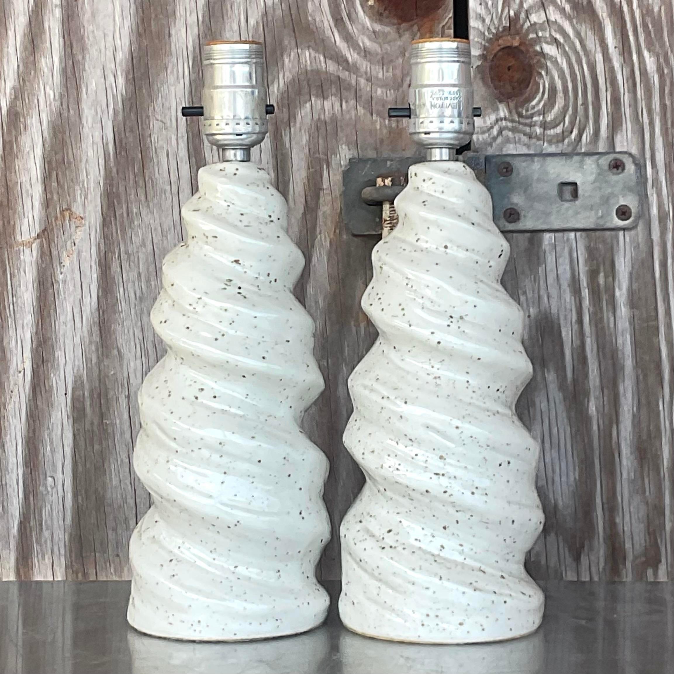 A fabulous pair of vintage Boho table lamps. A chic twist design in a neutral glazed ceramic. Acquired from a Palm Beach estate.