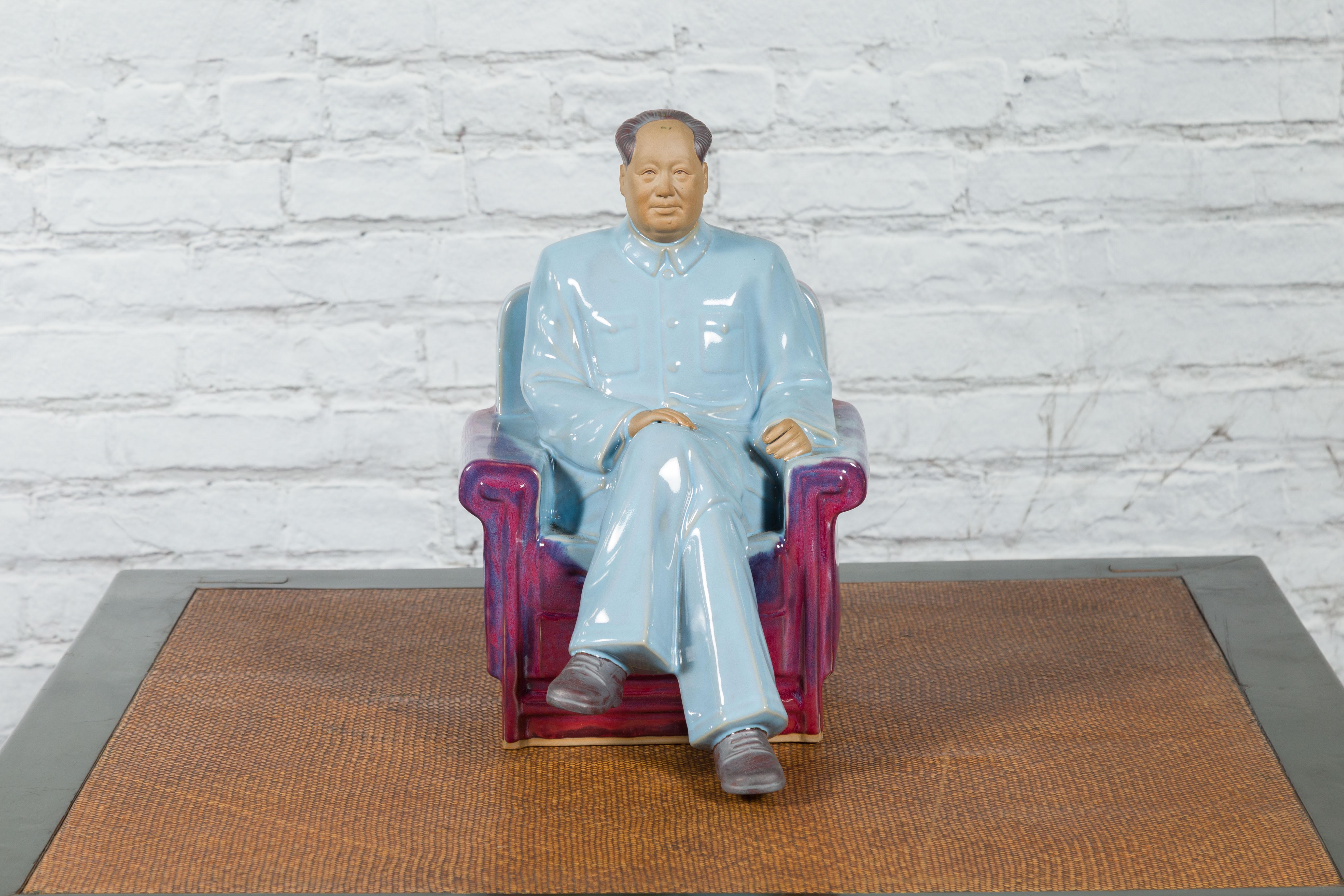 A Chinese porcelain statuette of Mao Zedong from the late 20th century, depicting him seated on a armchair with June style purple and blue glaze. Created in China during the last quarter of the 20th century, this porcelain statuette depicts Mao