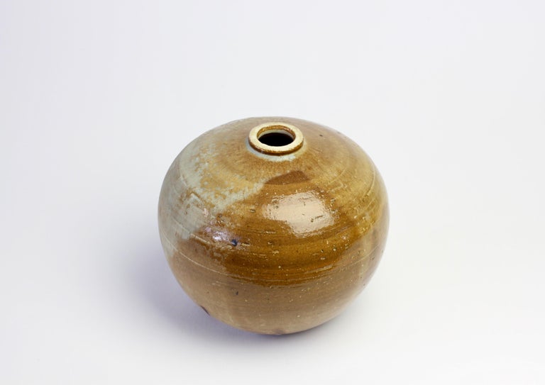 Beautiful brown salt glazed studio pottery vase or vessel. The piece is signed by the artist but we have not yet been able to identify them. Most certainly made in Europe somewhere between 1970s-1990s.