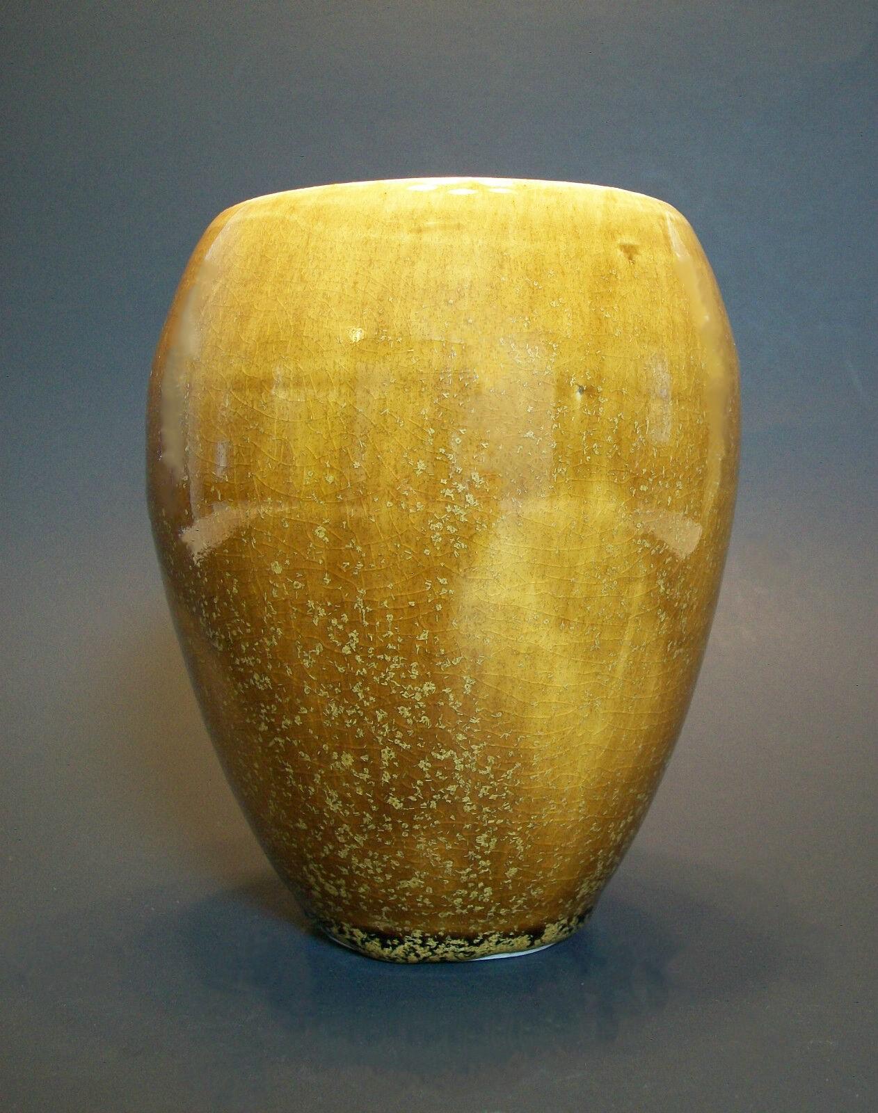 Vintage studio pottery vase with glossy butterscotch glaze - wheel thrown body - initialed on the base - Canada - late 20th century.

Good vintage condition - irregular body & glaze that comes with studio pottery and hand made items - no loss - no