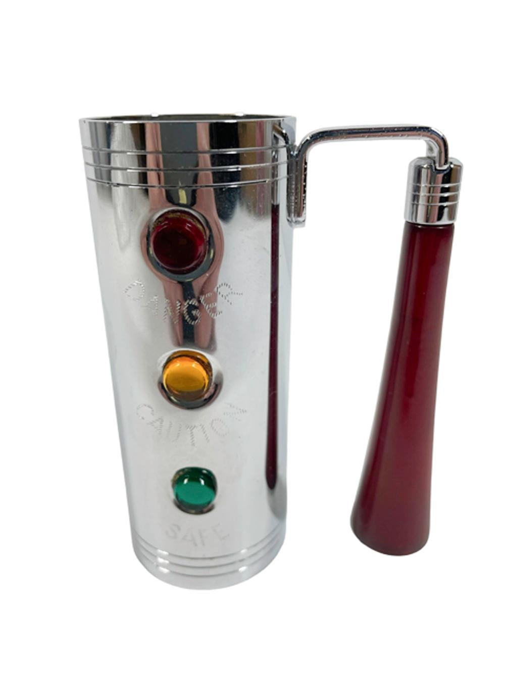 Chrome cylindrical spirit measure / jigger with red Bakelite handle made by Glo-Hill. The cylindrical 'stop light' measure with green, yellow and red 