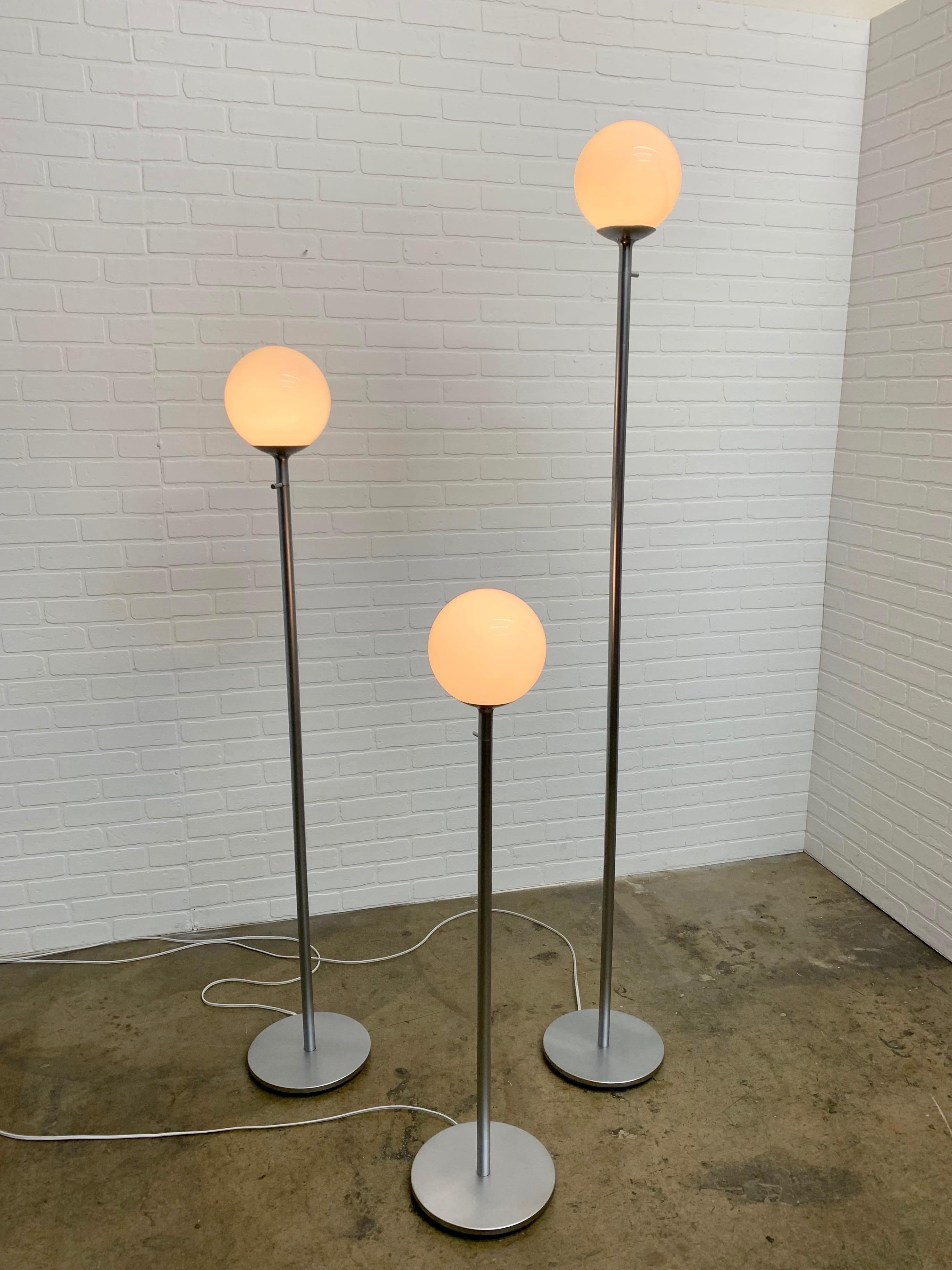 Set of three Pedestal metal base with glass threaded globe floor lamps by ClassiCon.
Measures: Width 10.5/8s
height
1. 76.25
2. 60.5
3. 44.75.