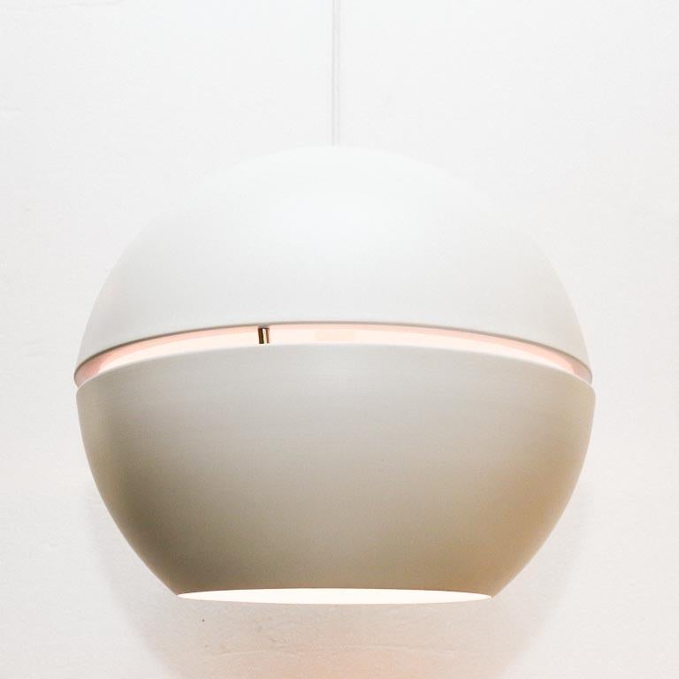 Vintage globe pendant lamp by Habitat, UK. This minimal design's sole feature other than the hole in the bottom is the open slit going around its circumference, which projects a small band of light. Includes original color-matching ceiling