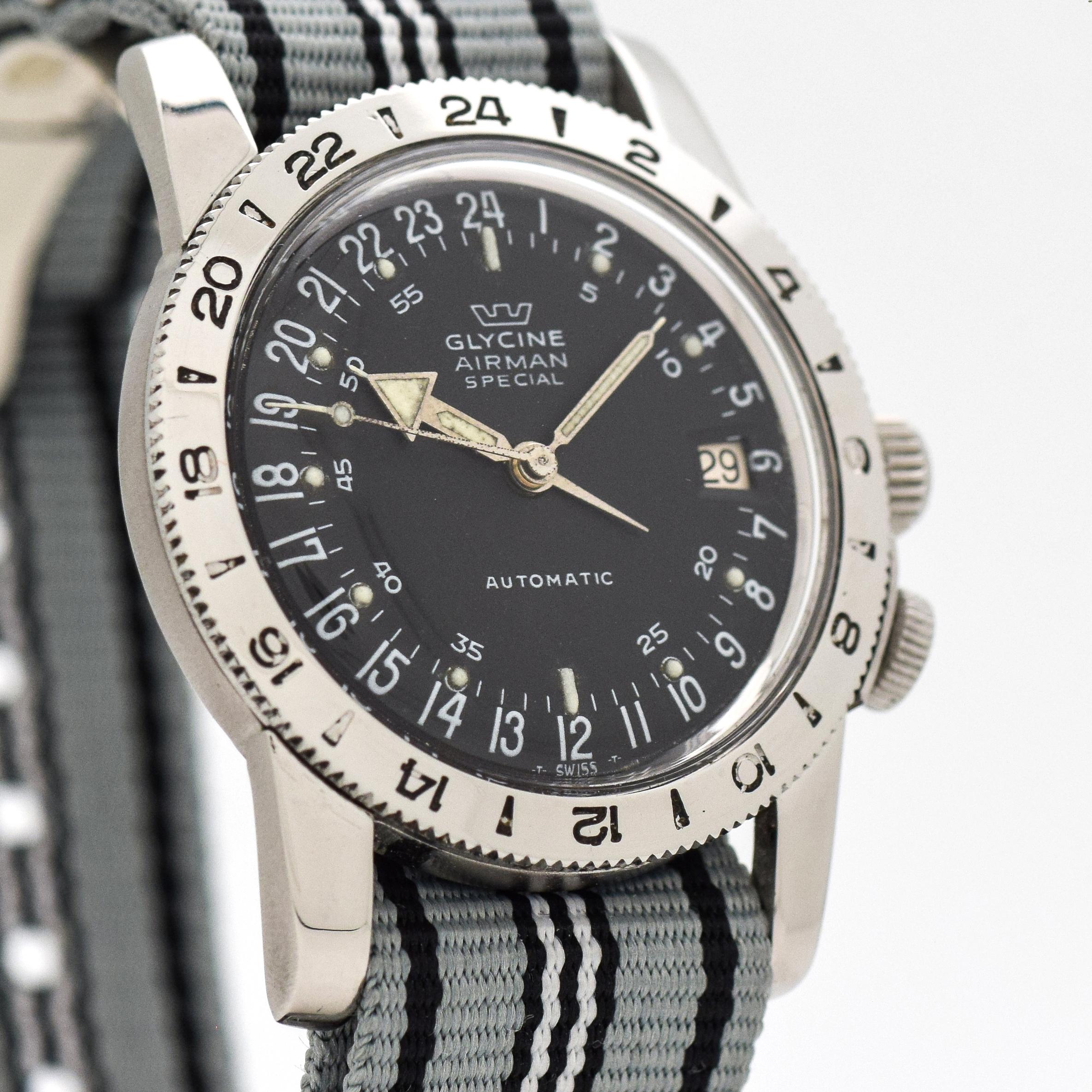1960's era Glycine Airman Special watch. Stainless Steel case with 24-Hour Military-style bezel. Original, patinated black dial. Equipped with a 17-jewel, automatic caliber movement. 35mm x 44mm lug to lug (1.38 in. x 1.73 in.) - Featured on a Nylon