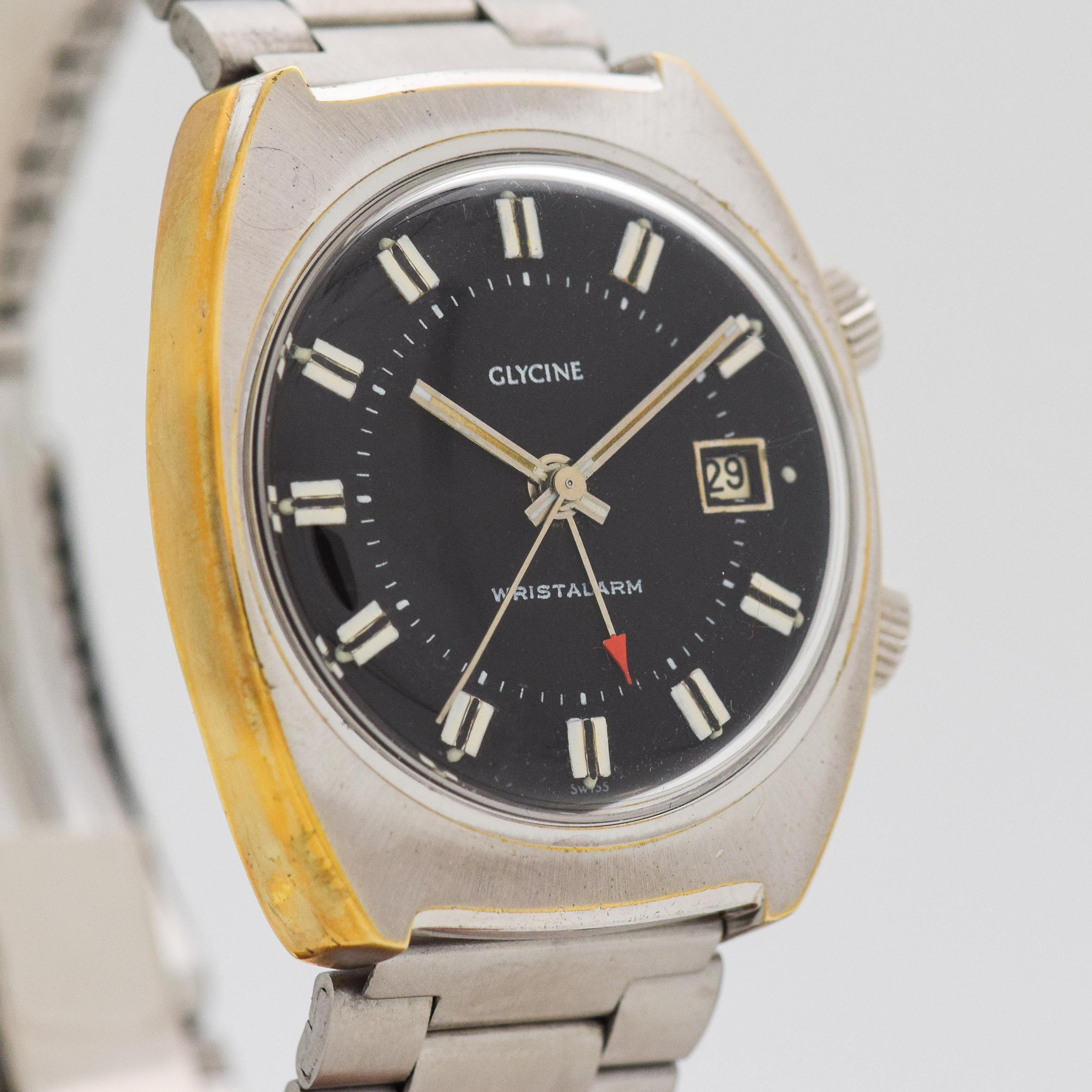 1970's Vintage Glycine Alarm Ref. 396/34 Chrome with Yellow Gold Plated Side of Case with Stainless Steel Case Back watch with Black Dial with Steel Bar Markers with Whit Paint and Black Inlay with Original Glycine Stainless Steel Bracelet. 35mm x