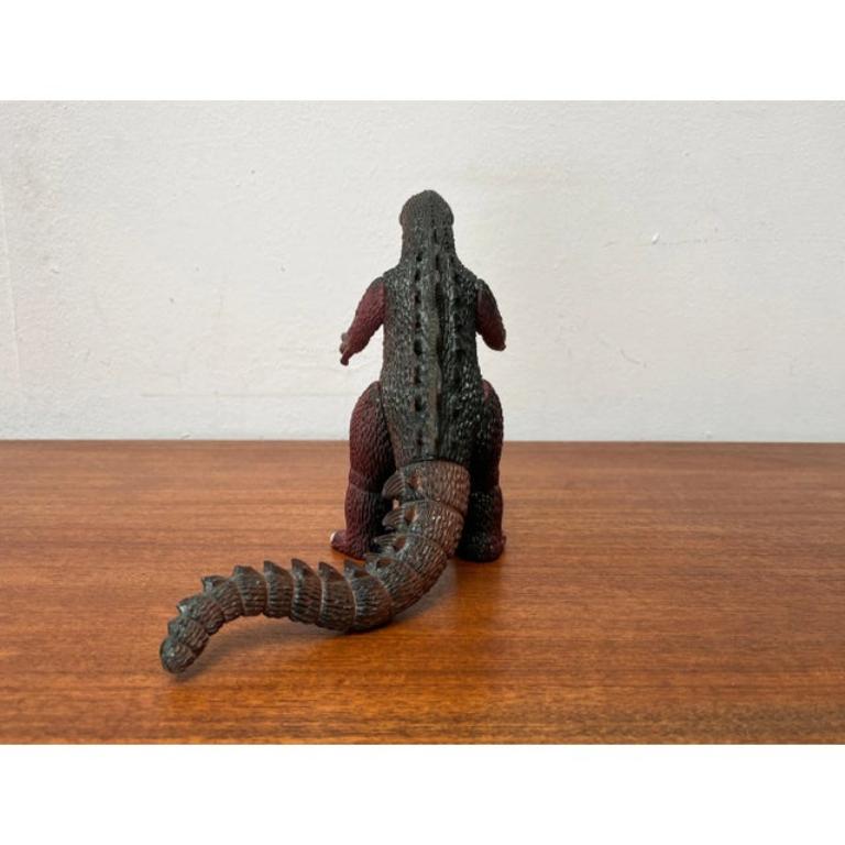Vintage Godzilla Action Figure, 1980s, in Very Good conditions. Designed 1980 to 1989

Additional information:
Materials: Plastic
Country of Origin: China
Color: Brown
Item Type: Vintage, Antique or Pre-owned
Dimensions: 4.33ʺW × 10.63ʺD ×
