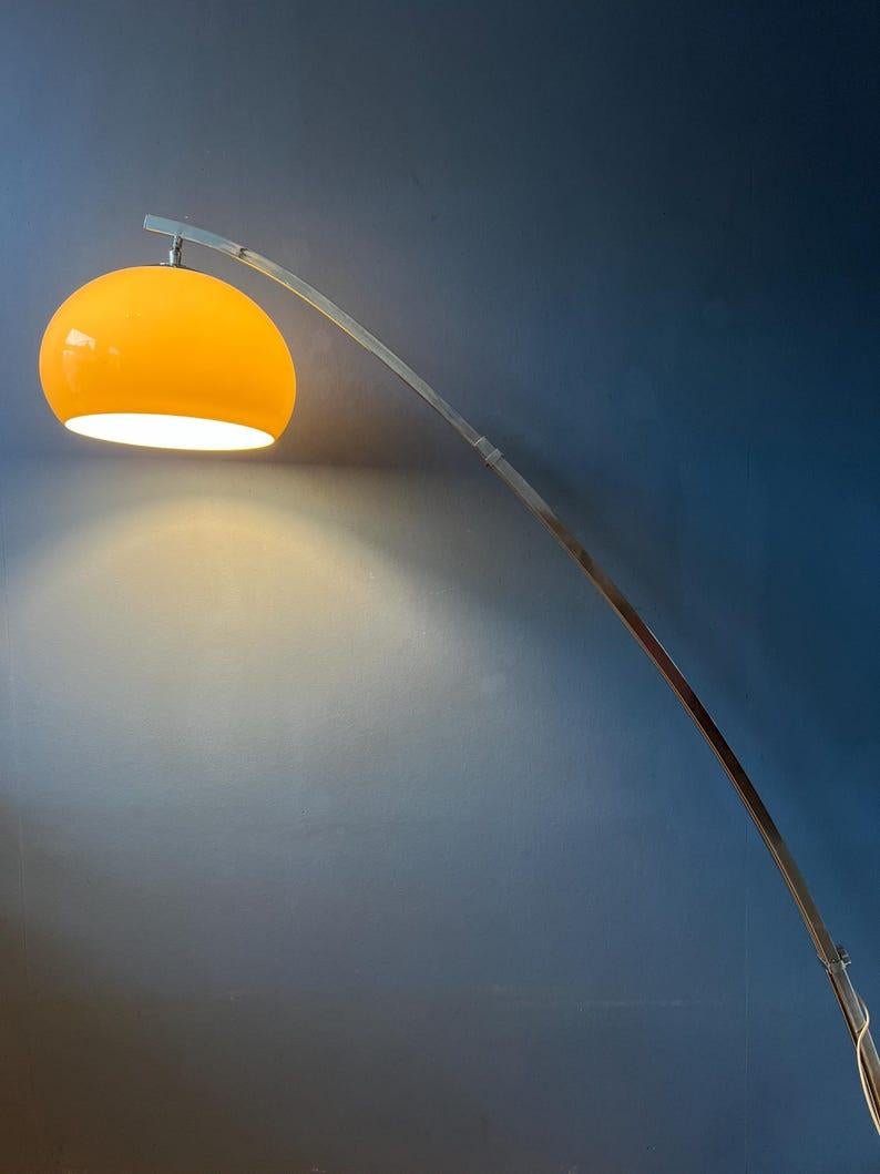 Very rare space age arc floor lamp with plexiglass mushroom shade by Goffredo Reggiani. The mocca coloured plexiglass shade produces a warm and delicate glow that reflects beautifully on the chrome frame. The height/length of the lamp can easily be