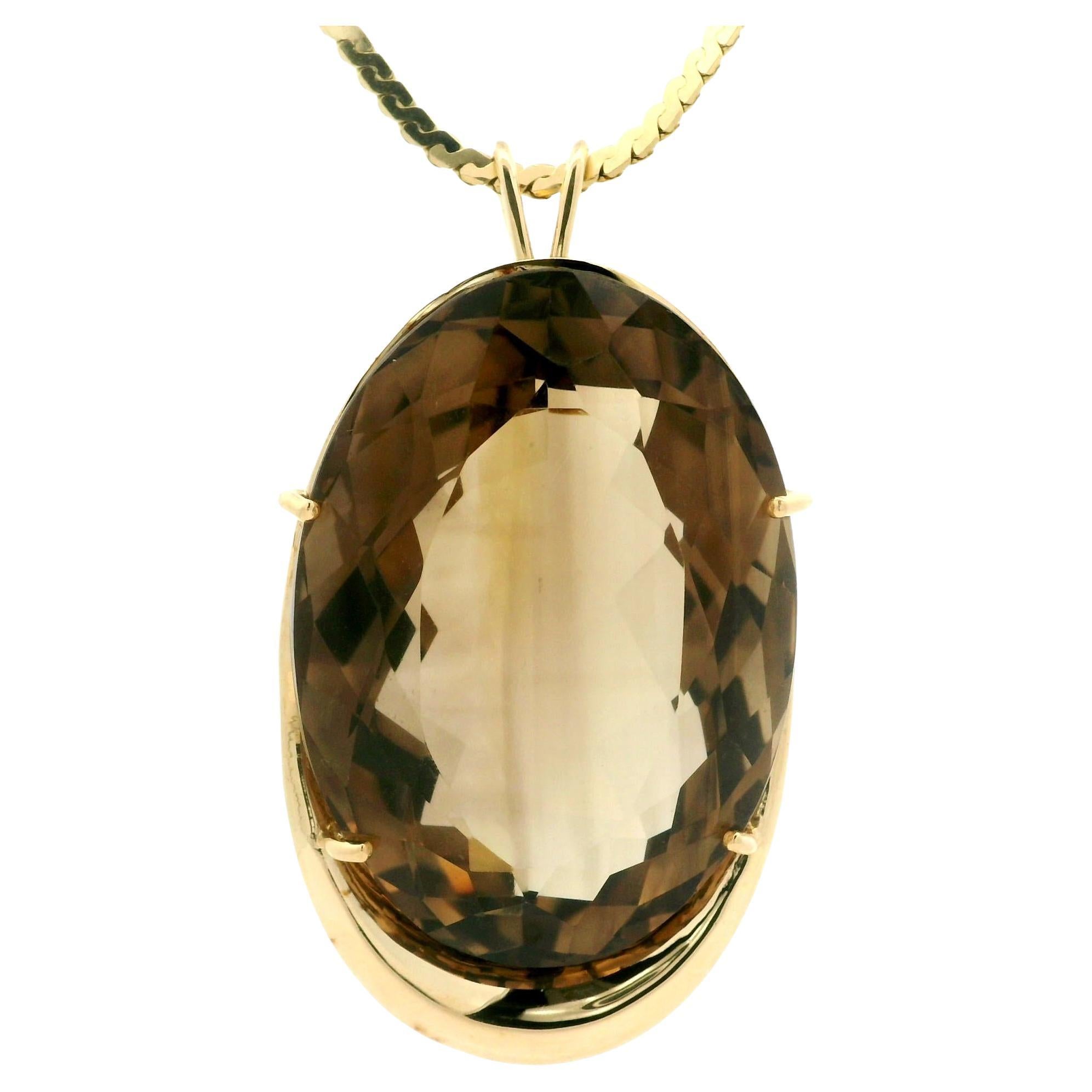 --Stone(s): --
(1) Natural Genuine Smoky Quartz - Large Huge Oval Cut - Prong Set - Transparent Medium Brown Color - 39.53x28.42x18.44mm - 109.80ct (approx.)

Material: Solid 14k Yellow Gold
Weight: 41.22 Grams
Pendant Overall Width: 30mm
