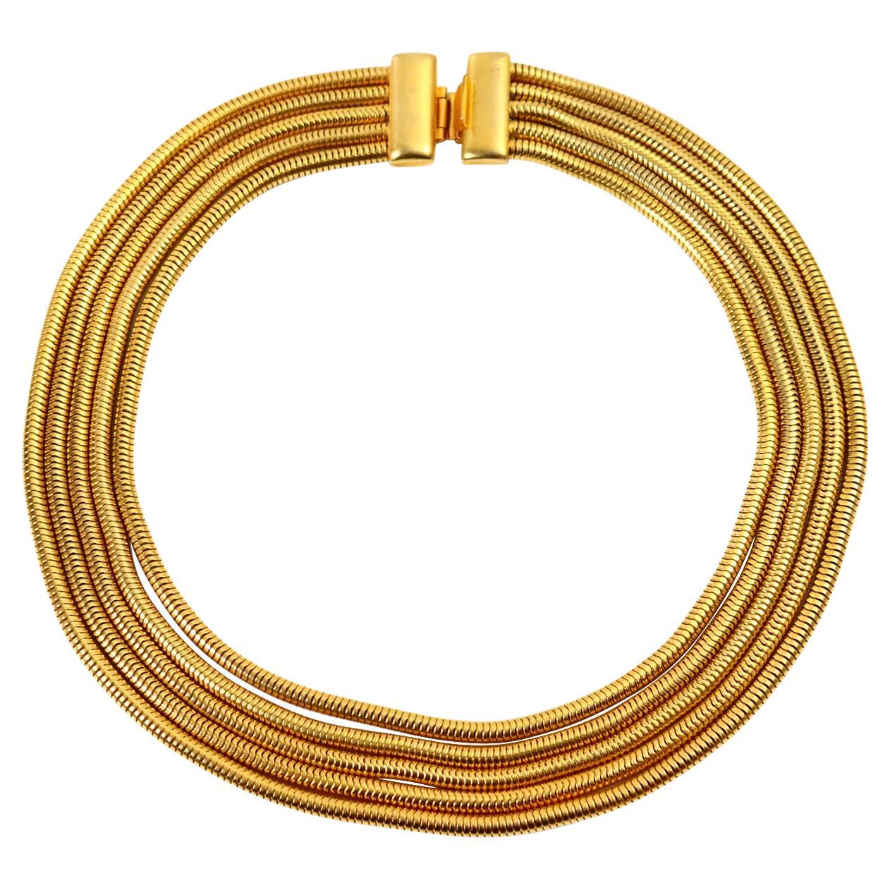 Vintage Gold 5 Strand Graduated Snake Chain Circa 1990s. A very classic snake chain necklace that can be dressed up or down.  There is a bracelet on site that matches this piece. This is a piece that will always elevate your wardrobe. Looks like