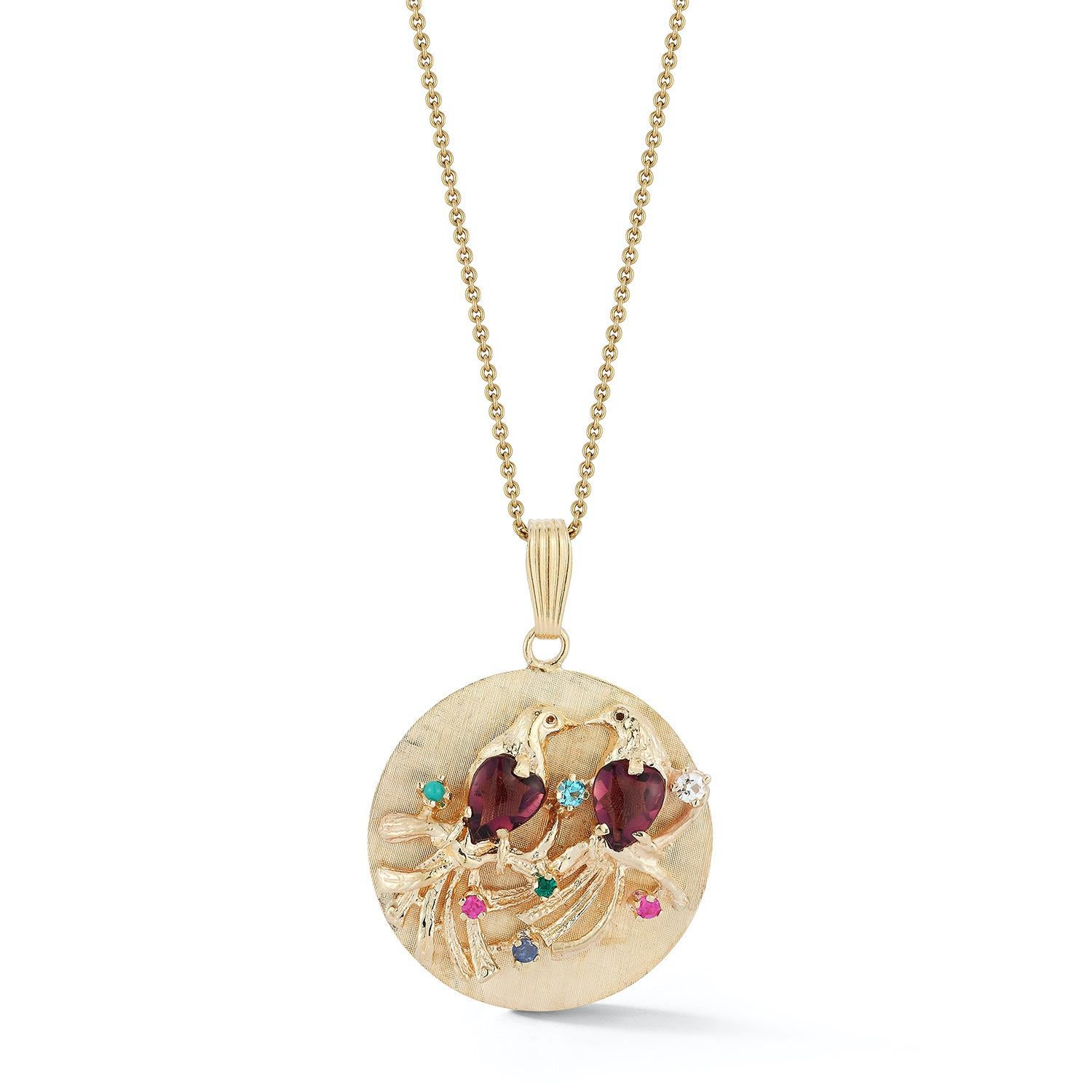 Vintage statement size disc charm with 2 raised lovebirds on branches. The chests of the lovebirds are set with two large amethysts.
The branches are set with sapphires and emerald, diamond and turquoise.
A beautiful and classic estate piece,