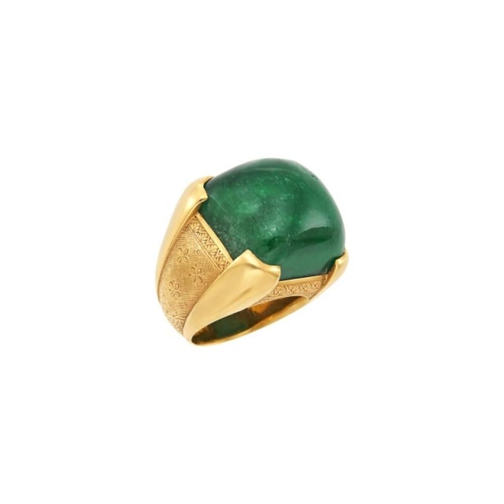 A vintage emerald and gold ring, showcasing a cushion-shaped cabochon emerald estimated at 37.25cts.