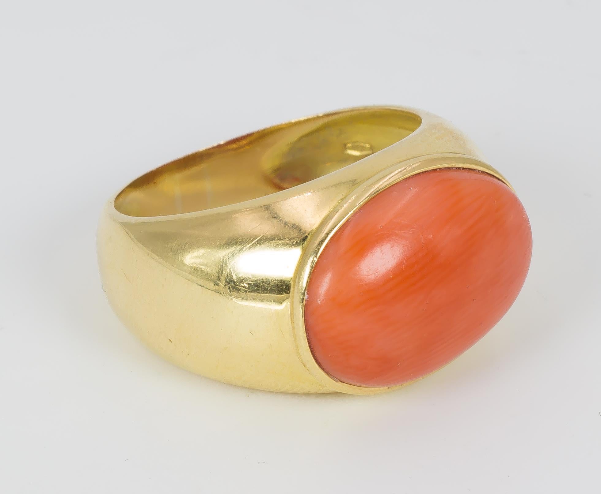 An elegant vintage ring, dating from the 1950s, and set with a beautiful central and oval orange coral in a gold setting.

MATERIALS
Gold and orange coral

RING SIZE
7 US (resizable)