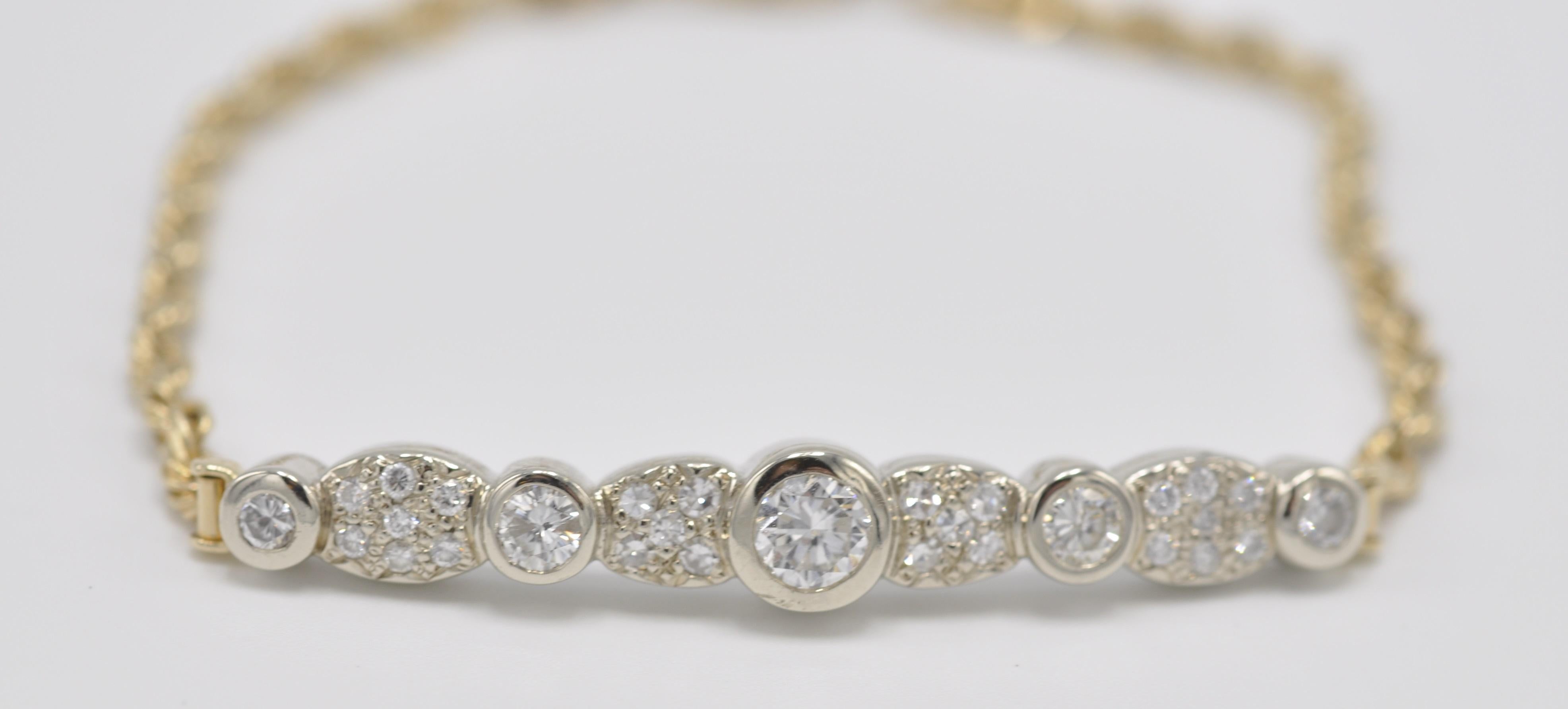14k Yellow and White Gold Combination, Custom Designed Vintage Bracelet with 1.25ctw Round Diamonds. The diamonds are H in color and SI in clarity. thereby adding to the luster and sparkle of this piece. The bracelet is 7.75 inches long but could be