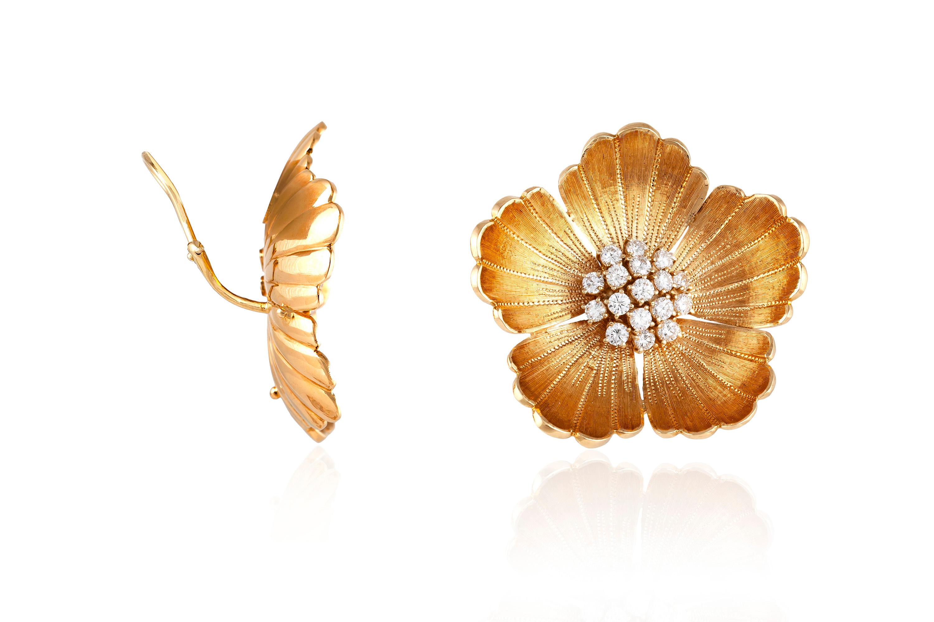 Vintage flower earrings, finely crafted in 18 k yellow gold with brilliant cut diamond clusters at the center, weighing a total of approximately 4.00 carat.