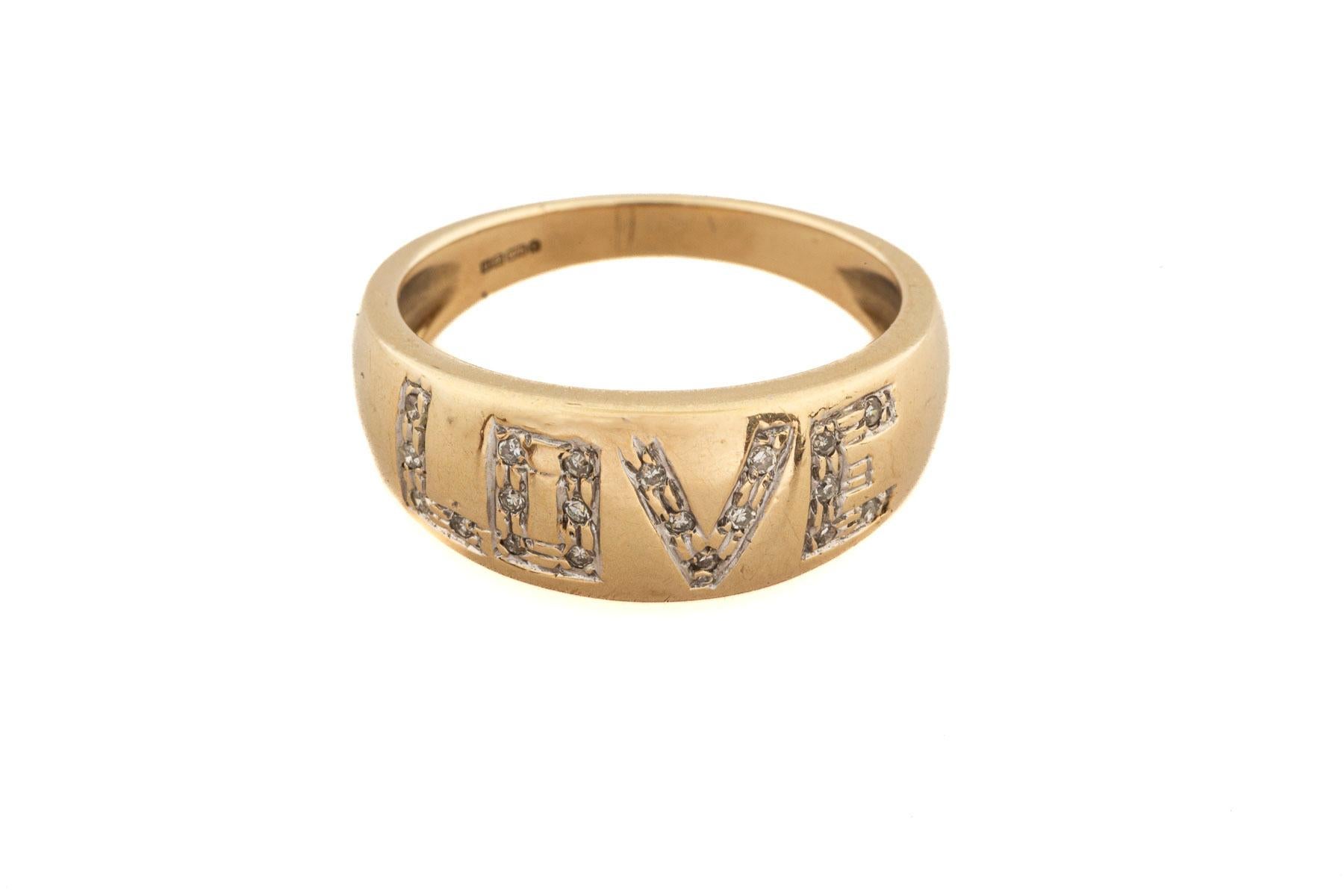 A vintage gold band that has a heart warming message of LOVE small diamonds. A reminder that love will make you happy as you journey through the day, weeks and months. After all what makes the world revolve positively. The band is 10kt gold made in