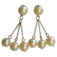 Boucles d'oreilles pendantes vintage en or et perles