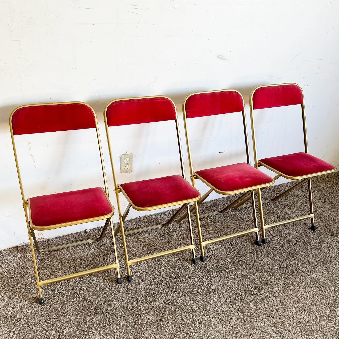 Step back into mid-century elegance with this set of four Vintage Gold and Red Folding Chairs by A. Fritz and Co. The luxurious gold frame and vibrant red seating create a beautiful contrast, blending functionality with style. These folding chairs