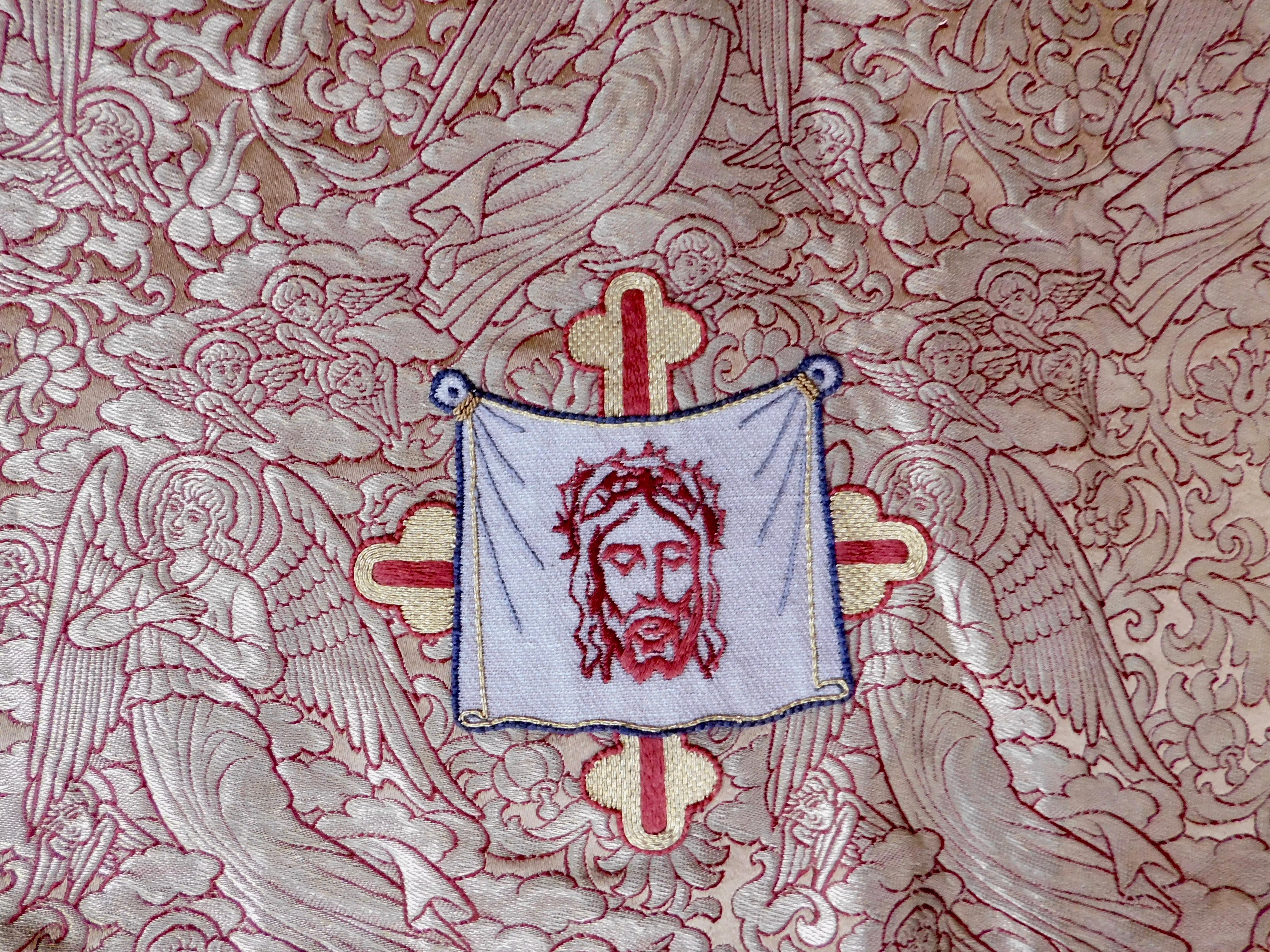 This Chalice veil is woven in metallic gold brocade with a central applique depicting Jesus during the Crucifixion . In good condition and easily made into a pillow cover.

Chalice Veil definition:
A square of material that covers the chalice and