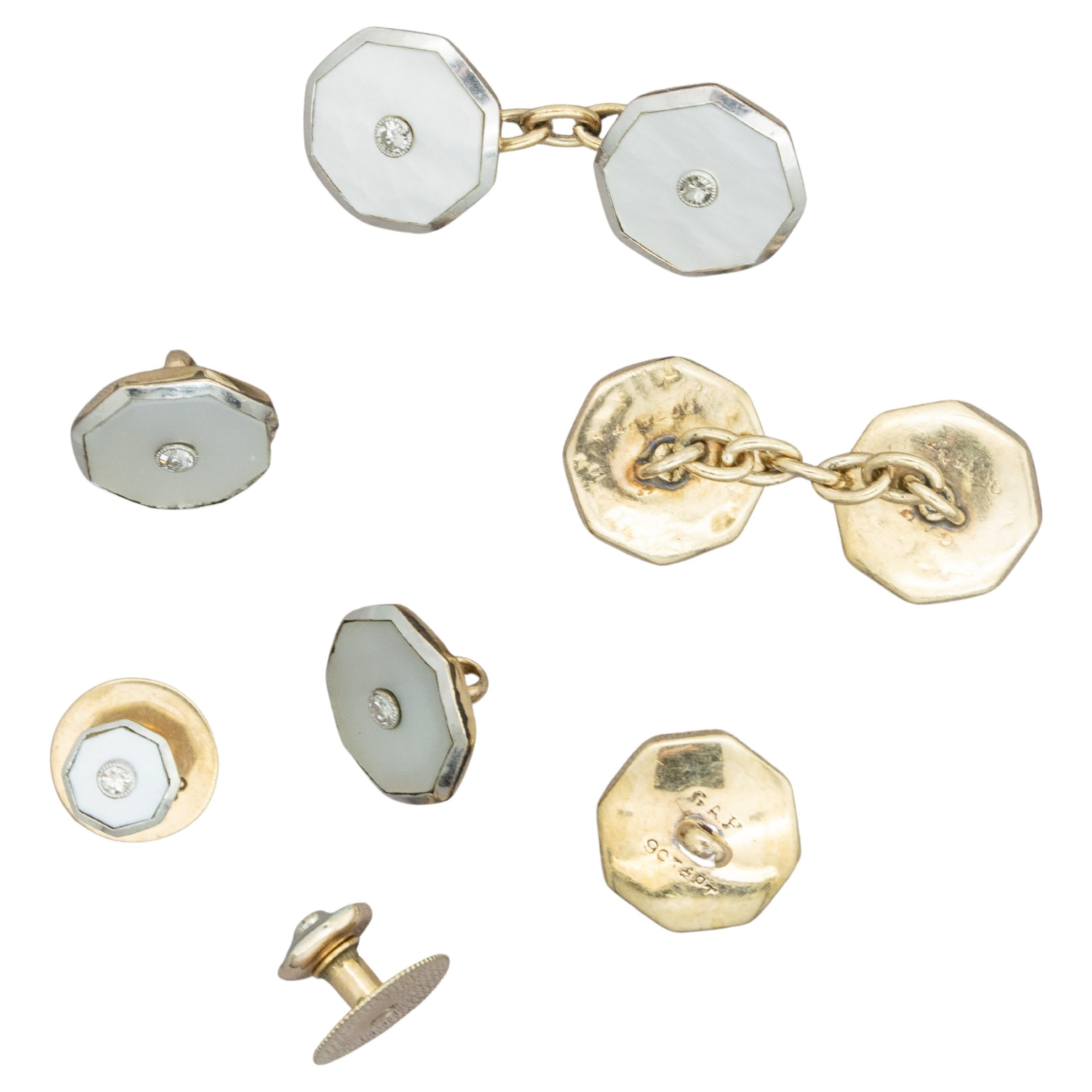 Full Set (7 pieces) 9ct Yellow gold Art Deco accessories for Tuxedo Dress Shirt, 
all in Octagonal design with Mother of Pearl surrounding the small 3 point Diamond set in the middle in Platinum
Comprising :
2 Double sided cufflinks with a chain,
