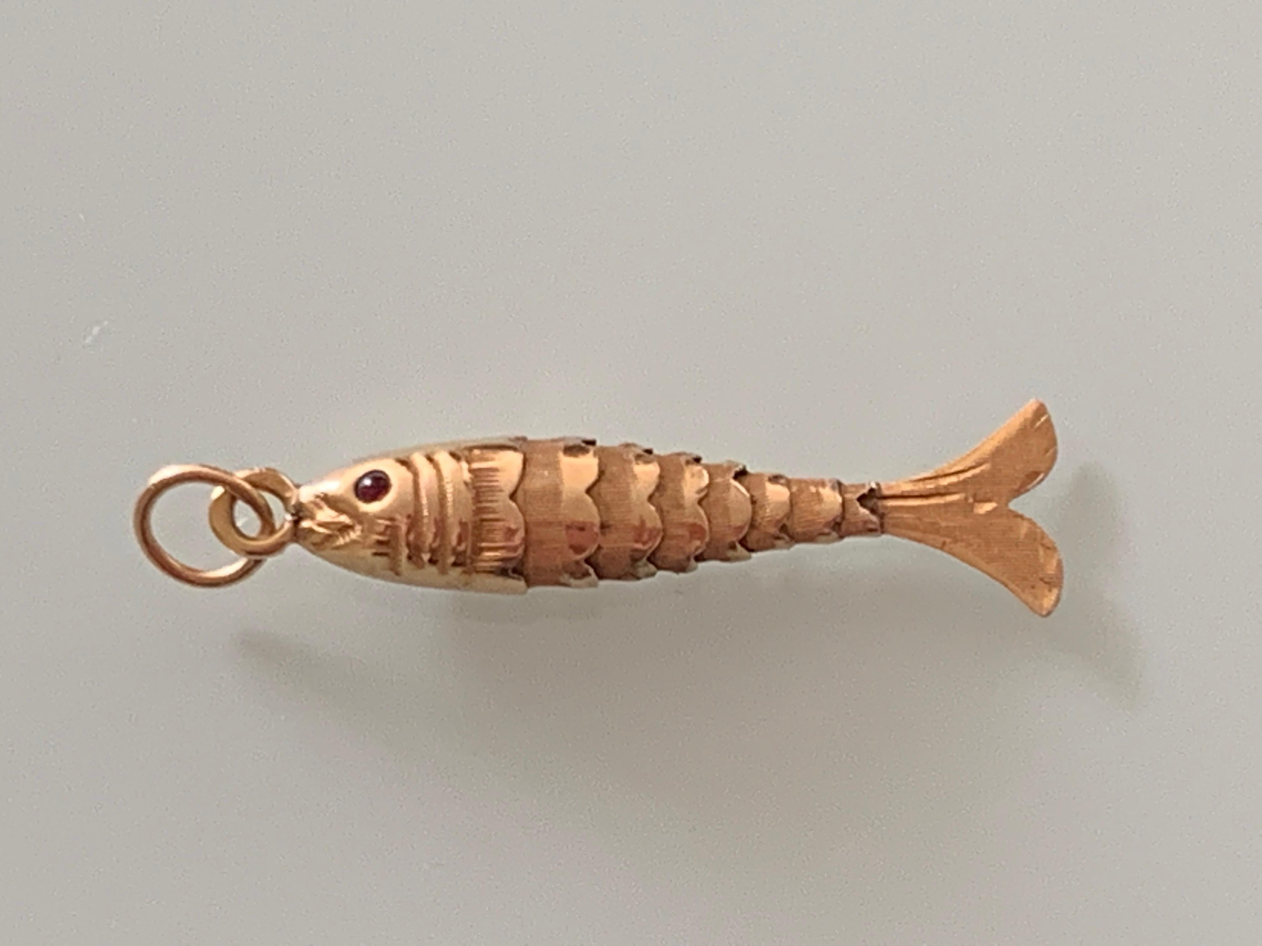 Beautiful Vintage Articulated Fish Pendant 
Each segment is beautifully hand etched 
with red gem stone eyes.
Portuguese stamp marks to the bail
( Marked 800 - clearly )
Circa 1940