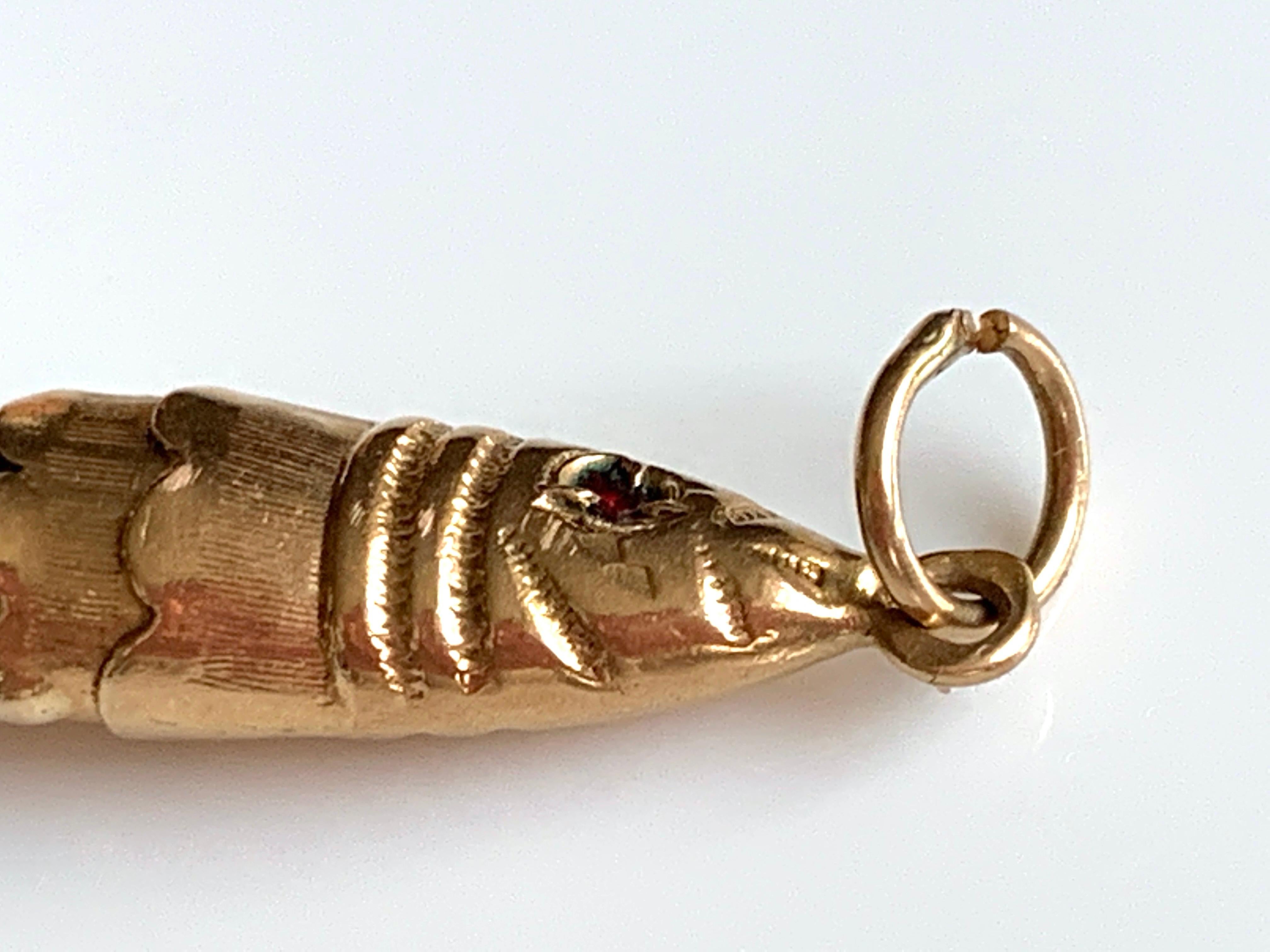 articulated fish pendant gold