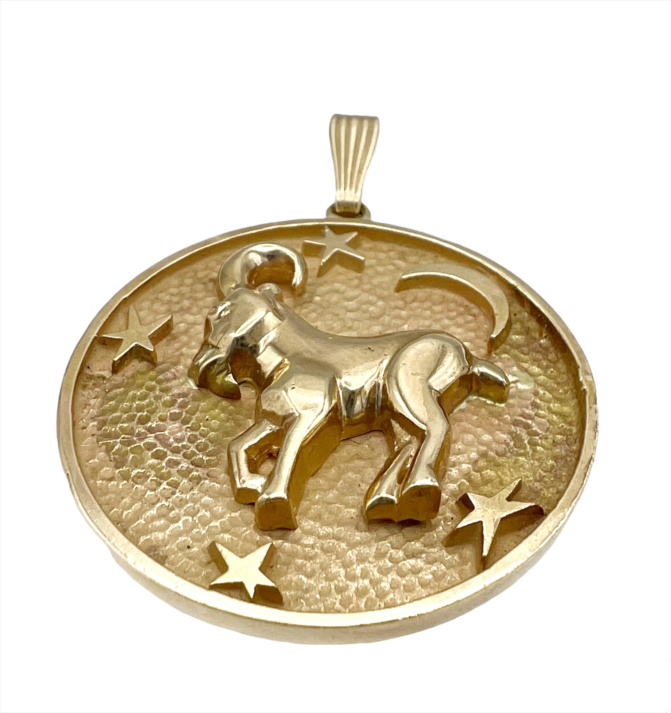 CIRCA: 1980
MATERIALS: 14K Yellow Gold
WEIGHT: 19.3 grams
MEASUREMENTS: 1- 3/8” diameter of the pendant, 2” diameter and the bail
HALLMARKS: 14K

Details:
A vintage gold astrological pendant, Capricorn sign, made of 14k gold.

​ A great Capricorn