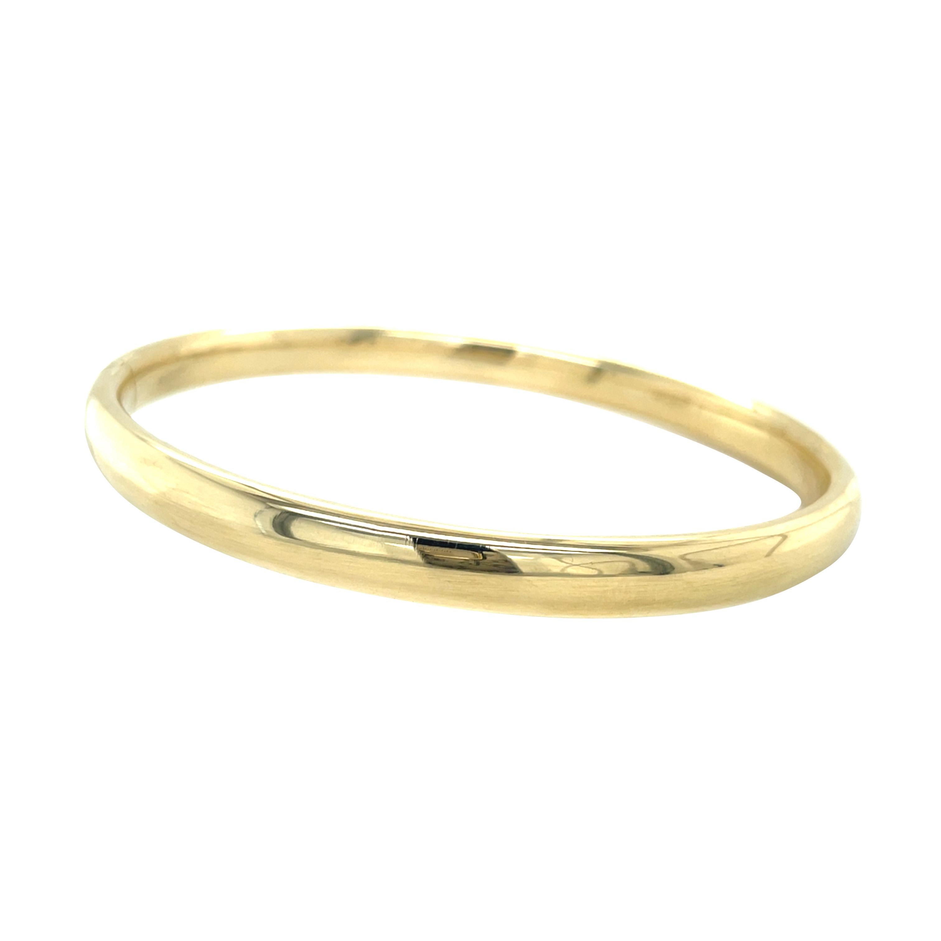Sleek, chic and ready for any occasion, this gold bangle feels luxuriously smooth when worn and has a glowing presence on the wrist. The half-round profile is extremely comfortable to wear. Weighing in at 13.2 grams this bangle is an elegant