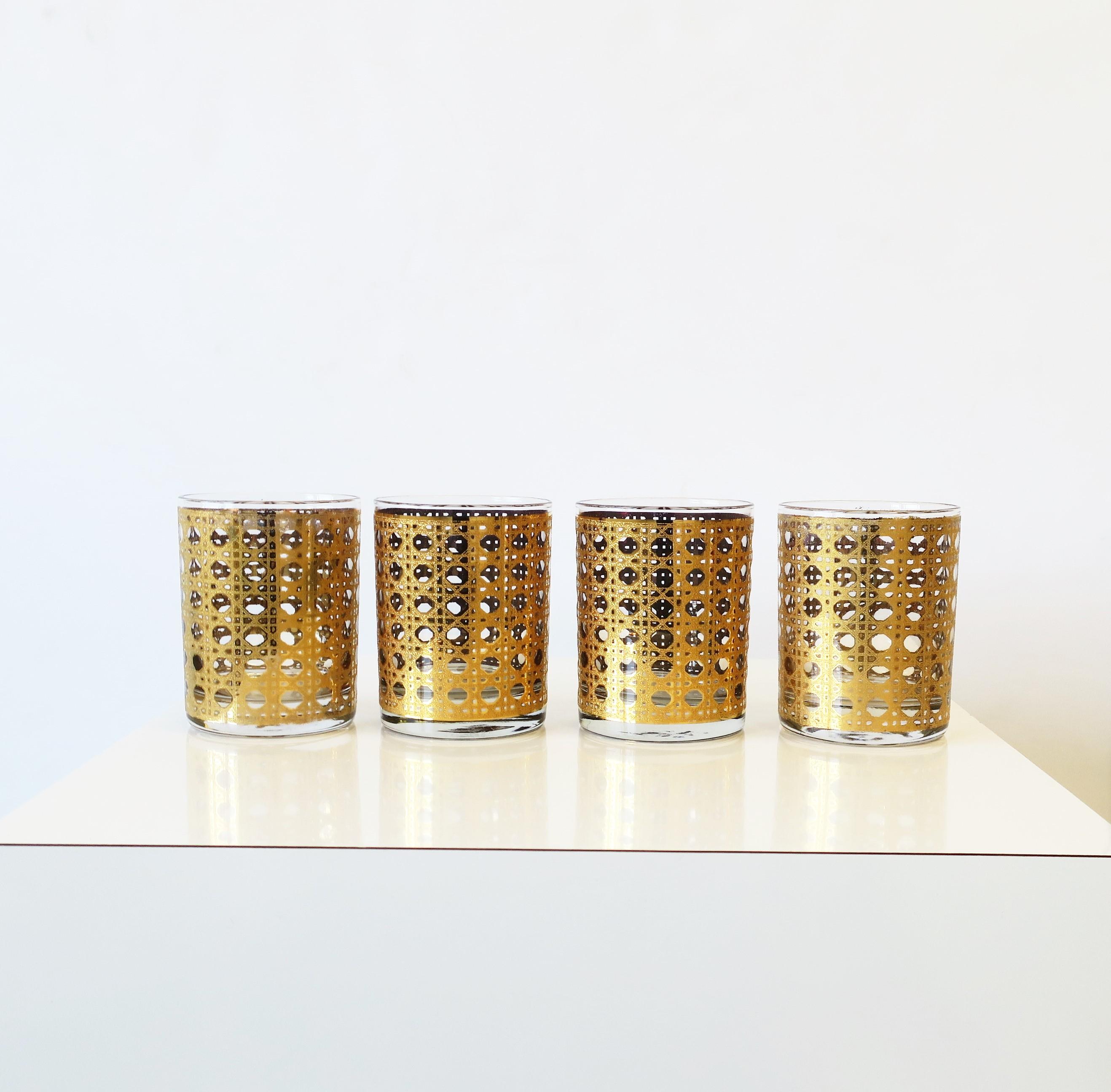 A rare vintage set of four (4) 22-karet gold wicker 'cane' pattern rocks' cocktail glasses, circa 1960s mid-20th century, USA. Glasses have a raised wicker 'cane' relief around exterior. A great addition to any bar, bar cart, cabinet, entertaining