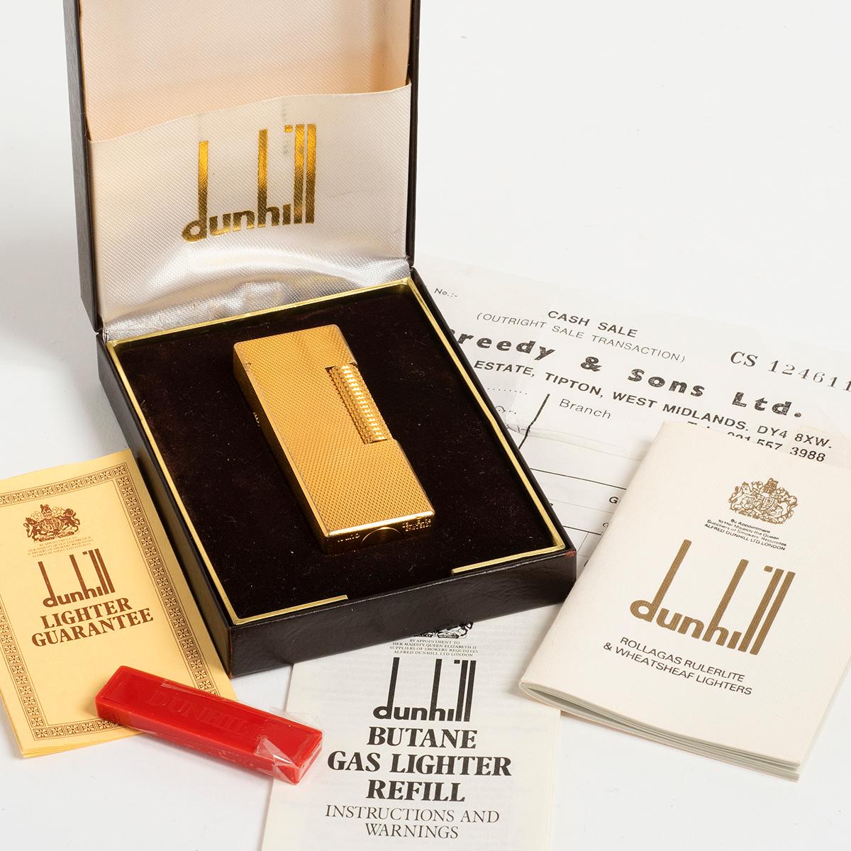 Our vintage Dunhill lighter in gold capped steel is presented in wonderful original condition with only light signs of use. Notably, this example comes with original box, warranty papers (undated) and purchase receipt dated 1979 as well as spare