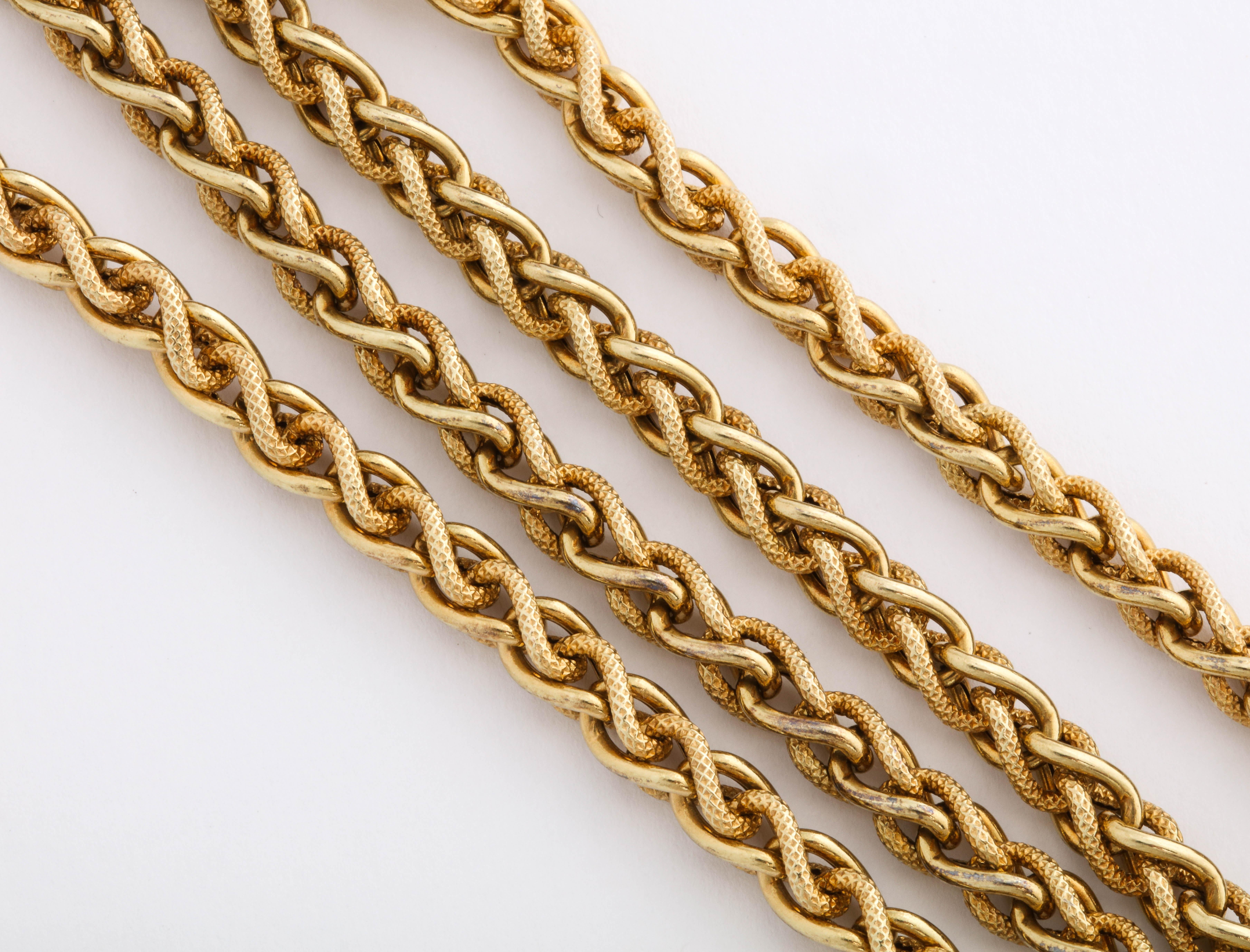 Twisted rope alternates in texture between textured and plain links in this pretty vintage chain. The twisting makes keeps the links free from scratches. The necklace is ornamental and perfect on its own, with a pendant of layered with other chains.