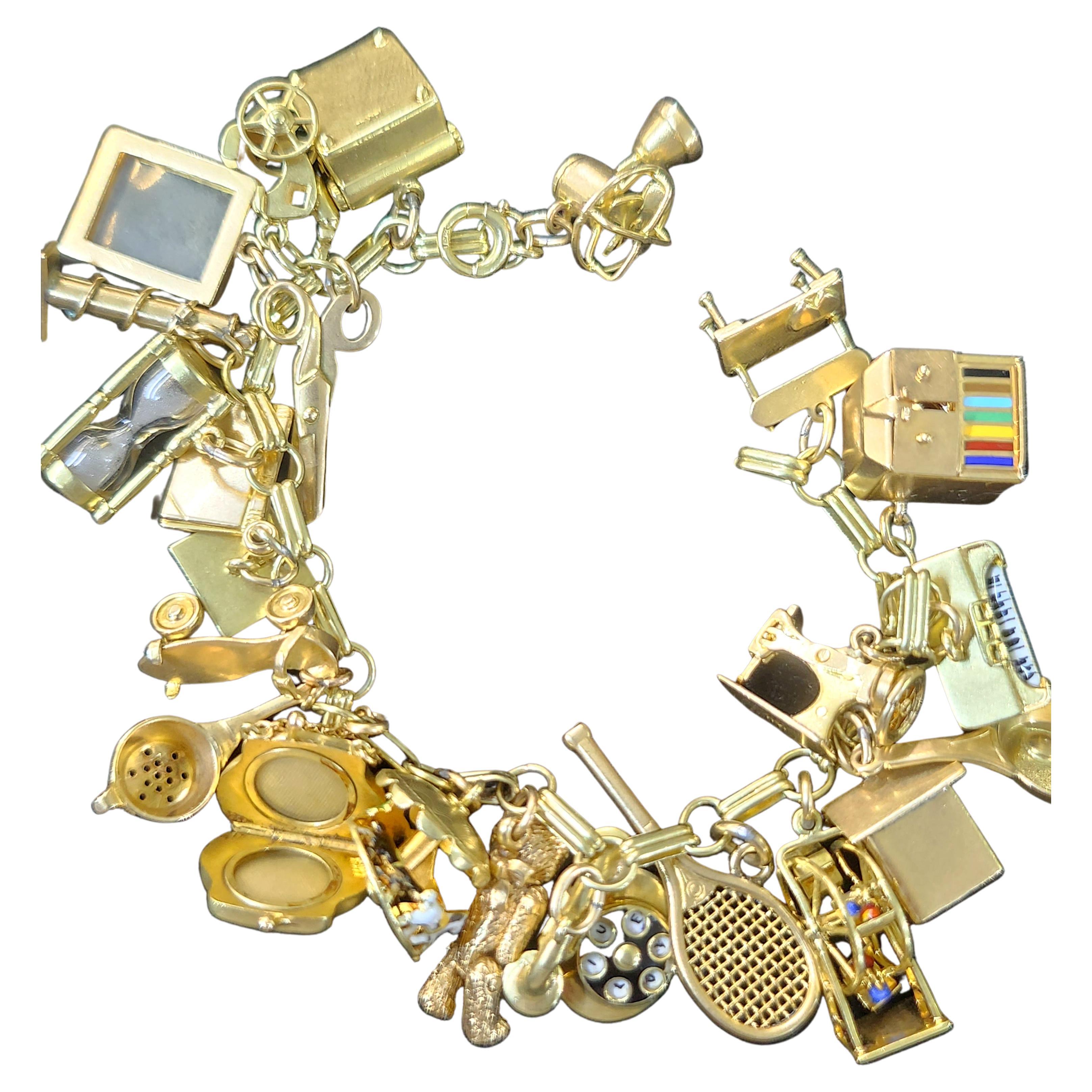Silver curb link charm bracelet, with fifteen charms including acorn, bear,  telephone and coins etc - Decorative Antiques & Collectors