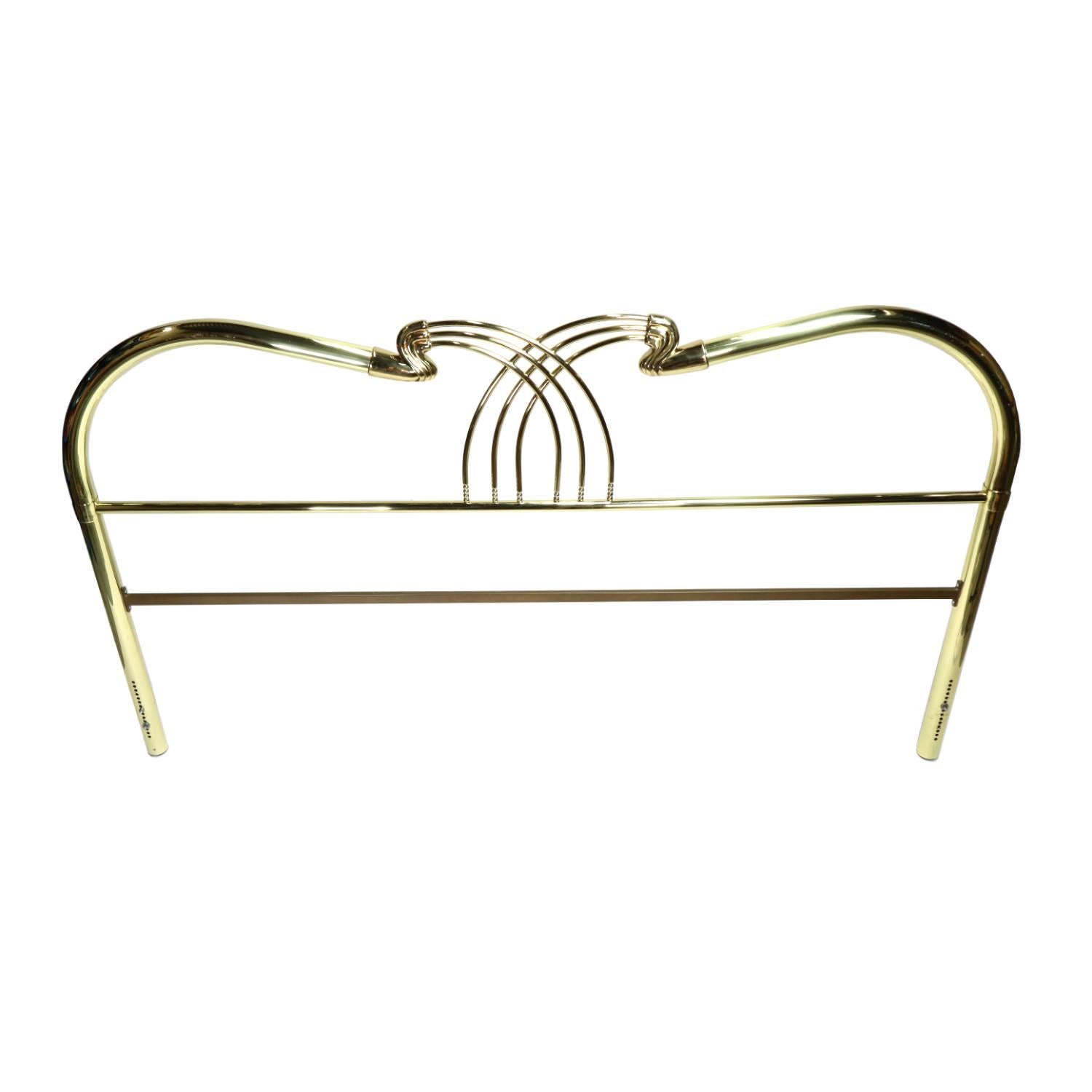 King size Art Deco brass bed headboard. The elegant Hollywood Regency headboard features graceful curves at the peak of the arch. The center of the headboard is embellished with a series of brass beads resembling an abacus. The brilliant gold finish