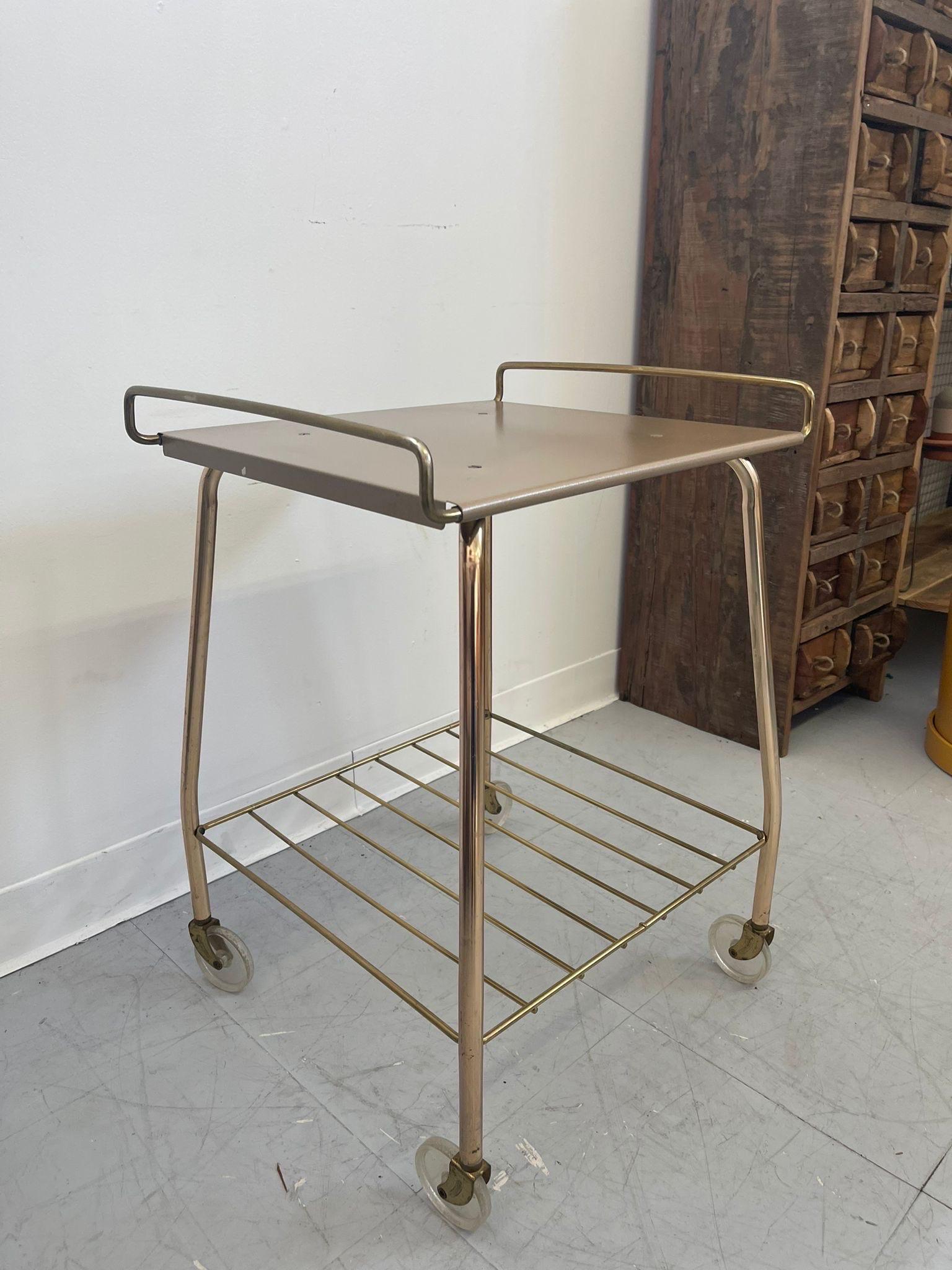 Vintage Cart 2 Tier with Rack on bottom. Clear Wheels. Vintage Condition Consistent with Age 

Dimensions. 18 W ; 16 D ; 24 H